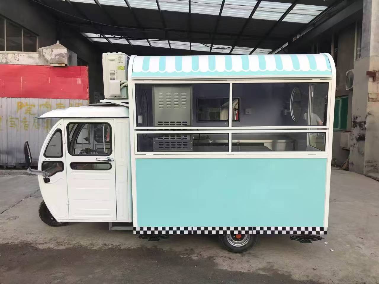 Blue and white three-wheeled food truck: A mobile and refreshing food station
