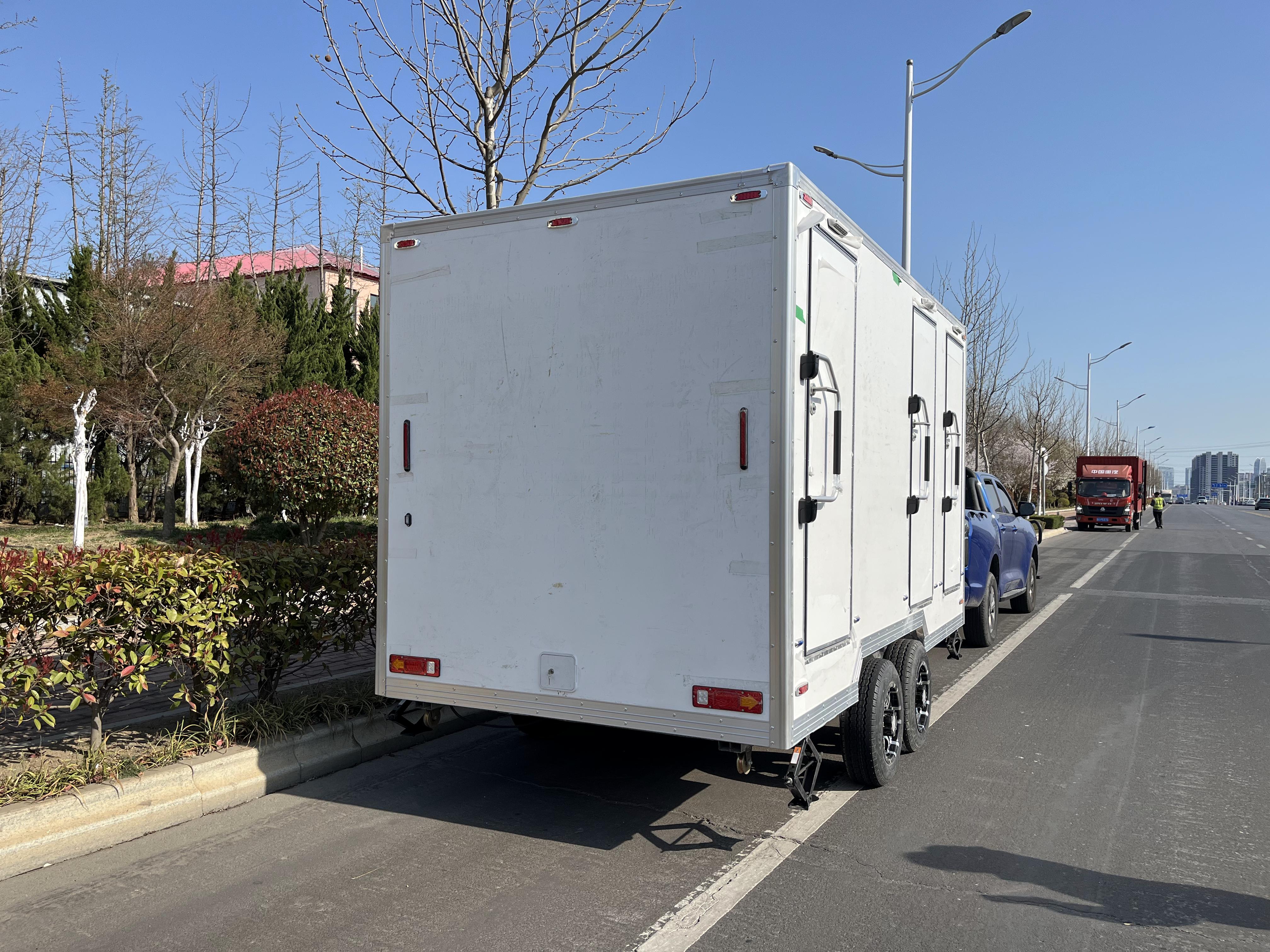 Three white trailer toilets, movable "sanitary fortresses", firmly safeguard cleanliness