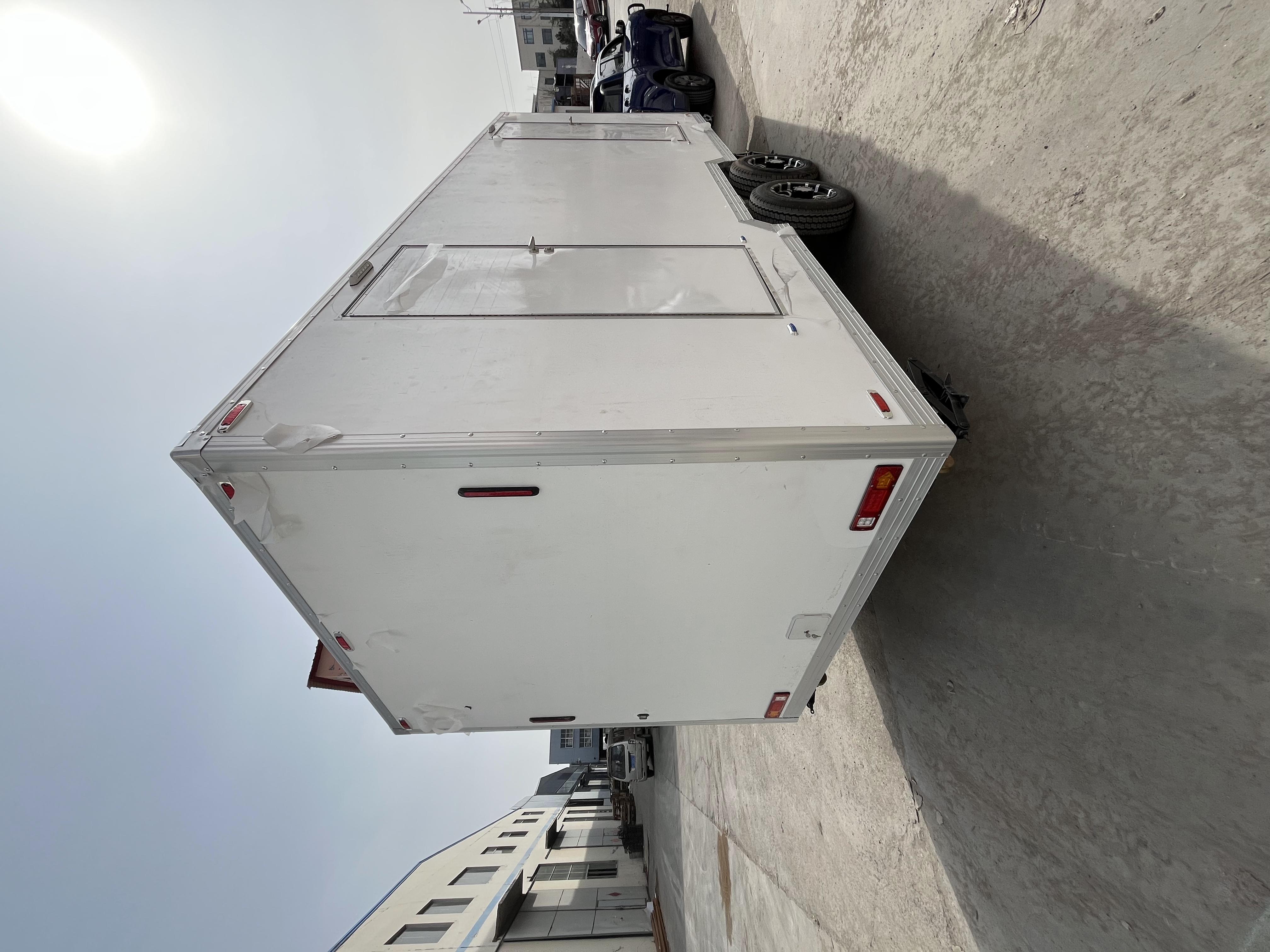 Two portable large white toilets