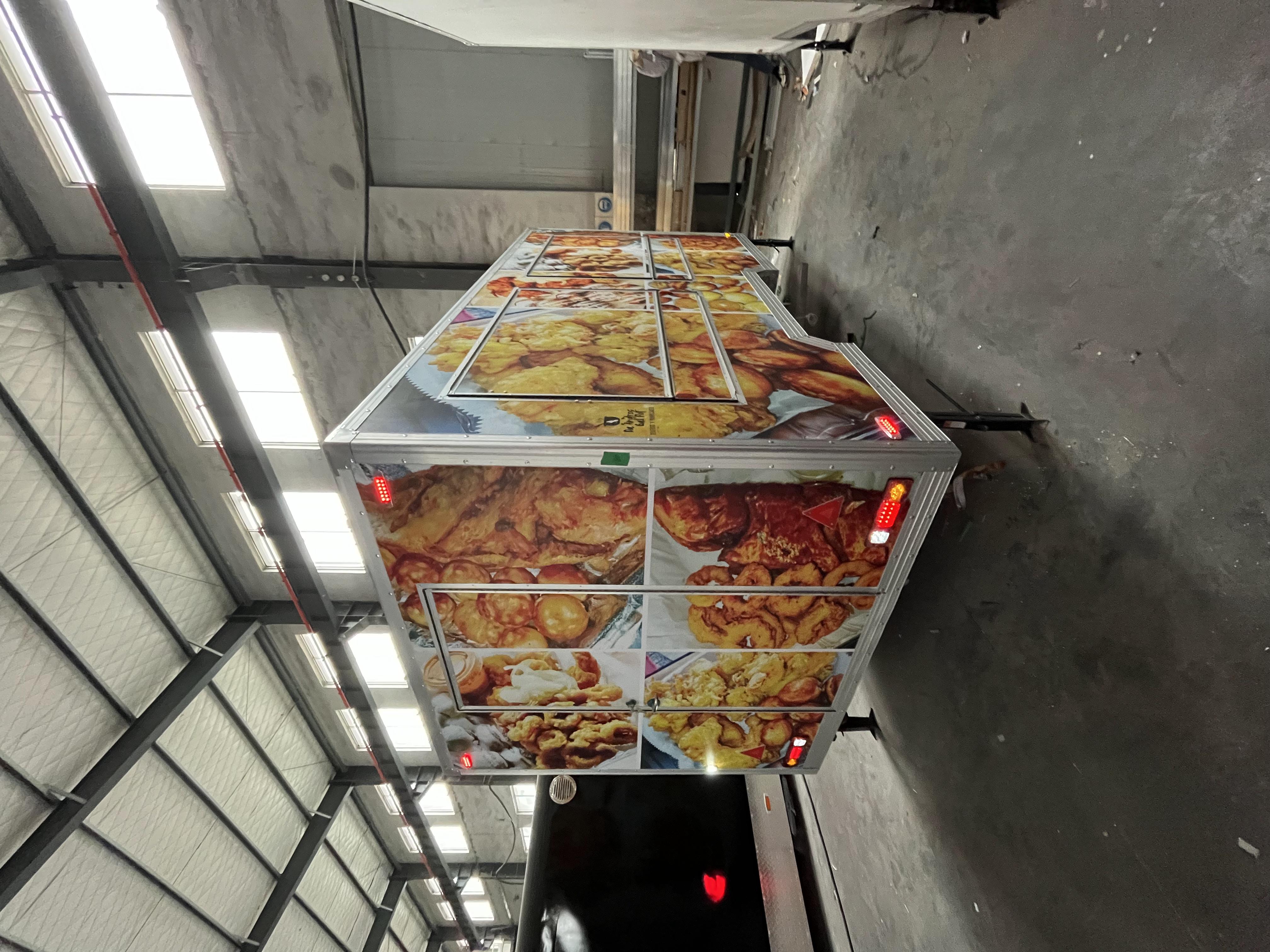 Fashionable yellow sticker trailer food truck, a new landmark of street trend food