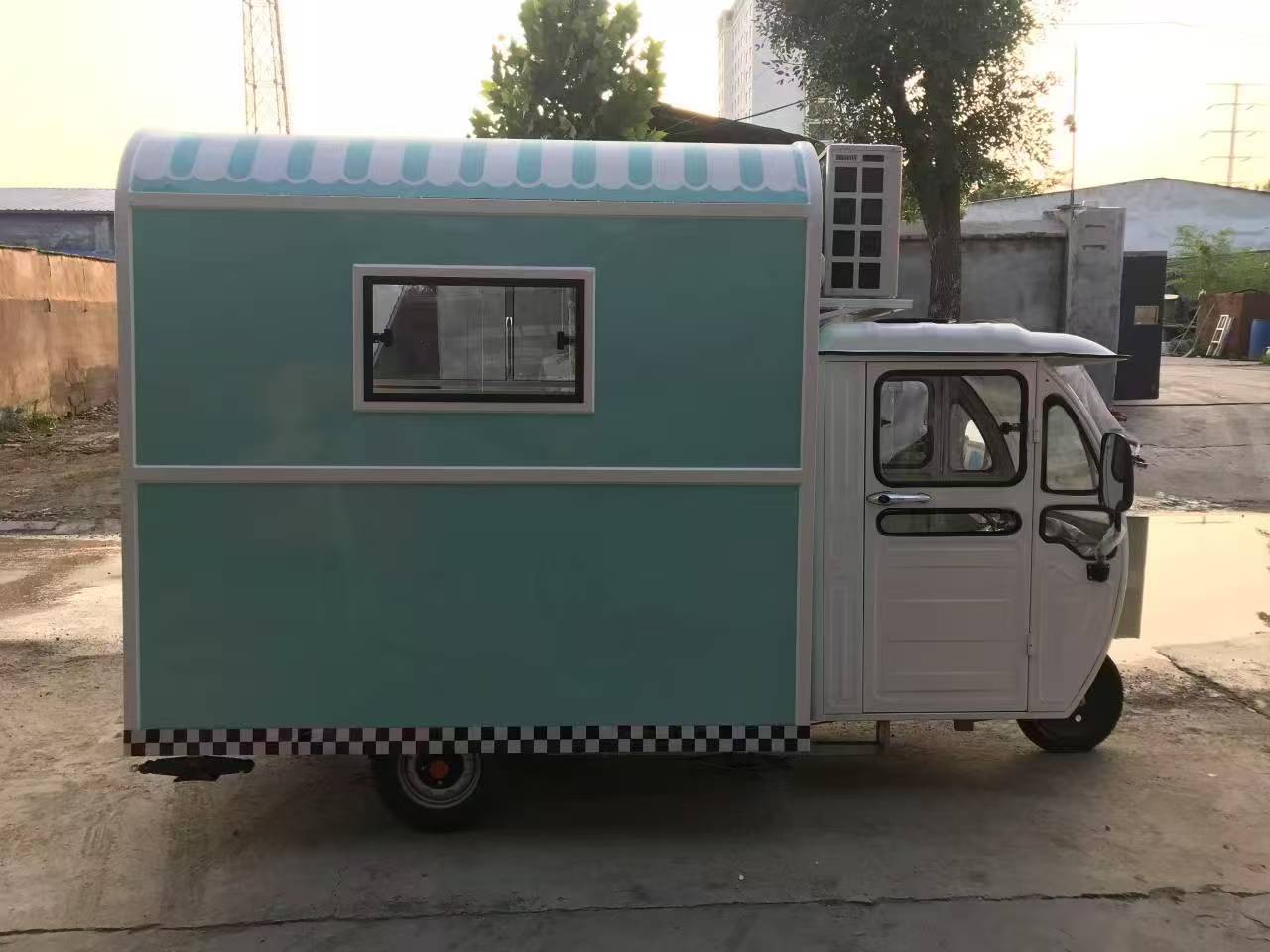 Blue and white three-wheeled food truck: A mobile and refreshing food station