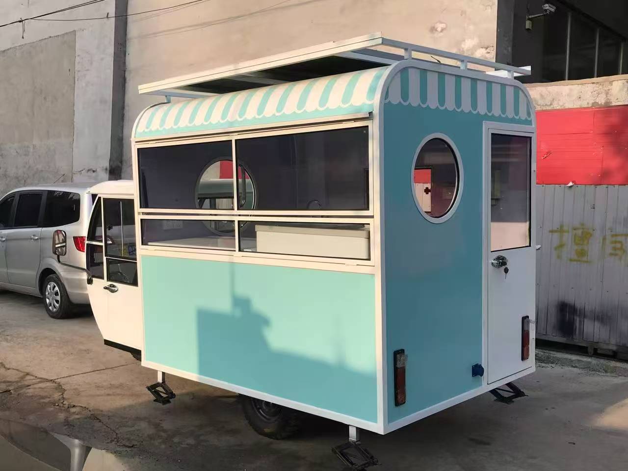 Blue and white three-wheeled food truck: A mobile and refreshing food station