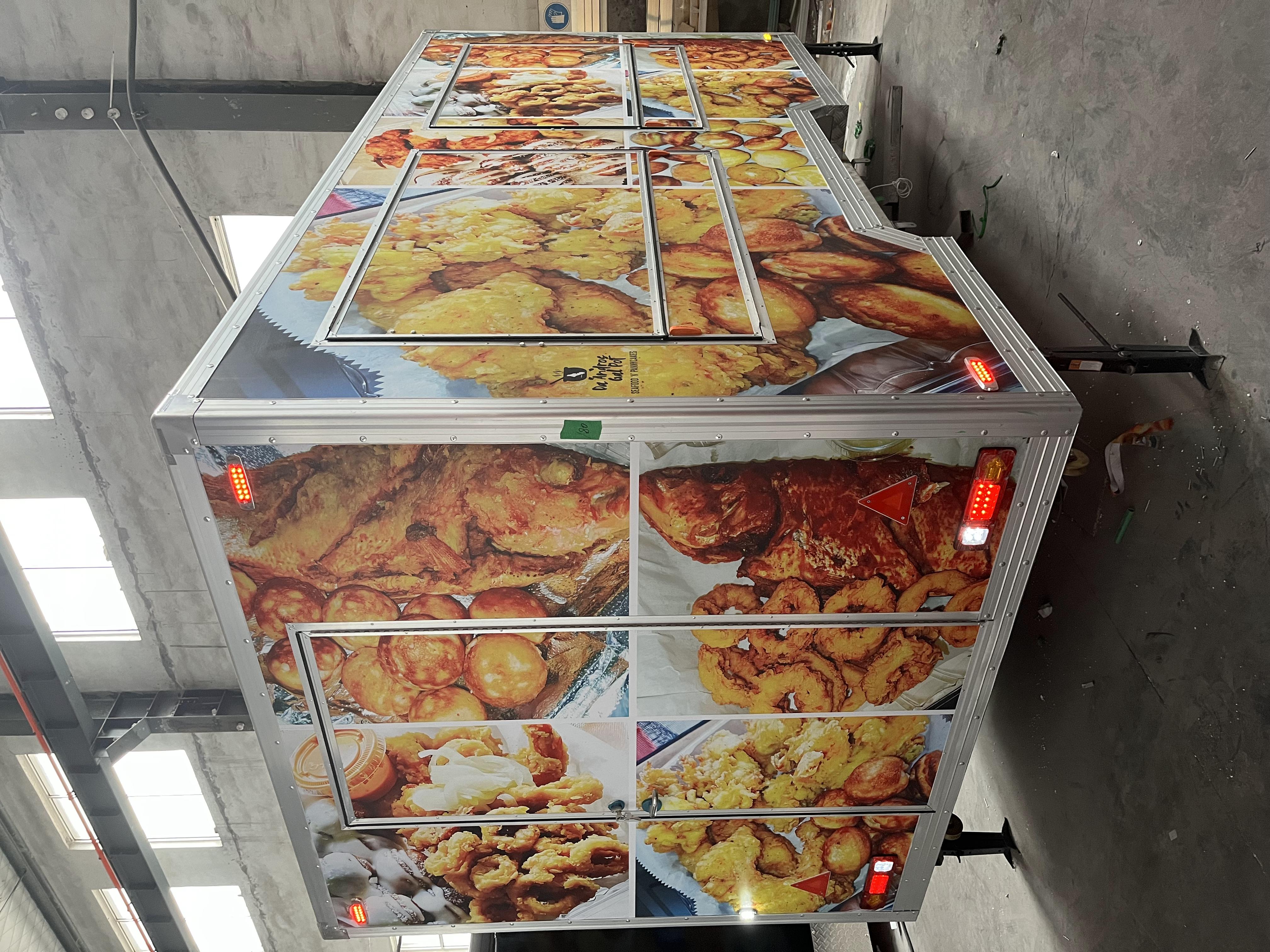 Fashionable yellow sticker trailer food truck, a new landmark of street trend food