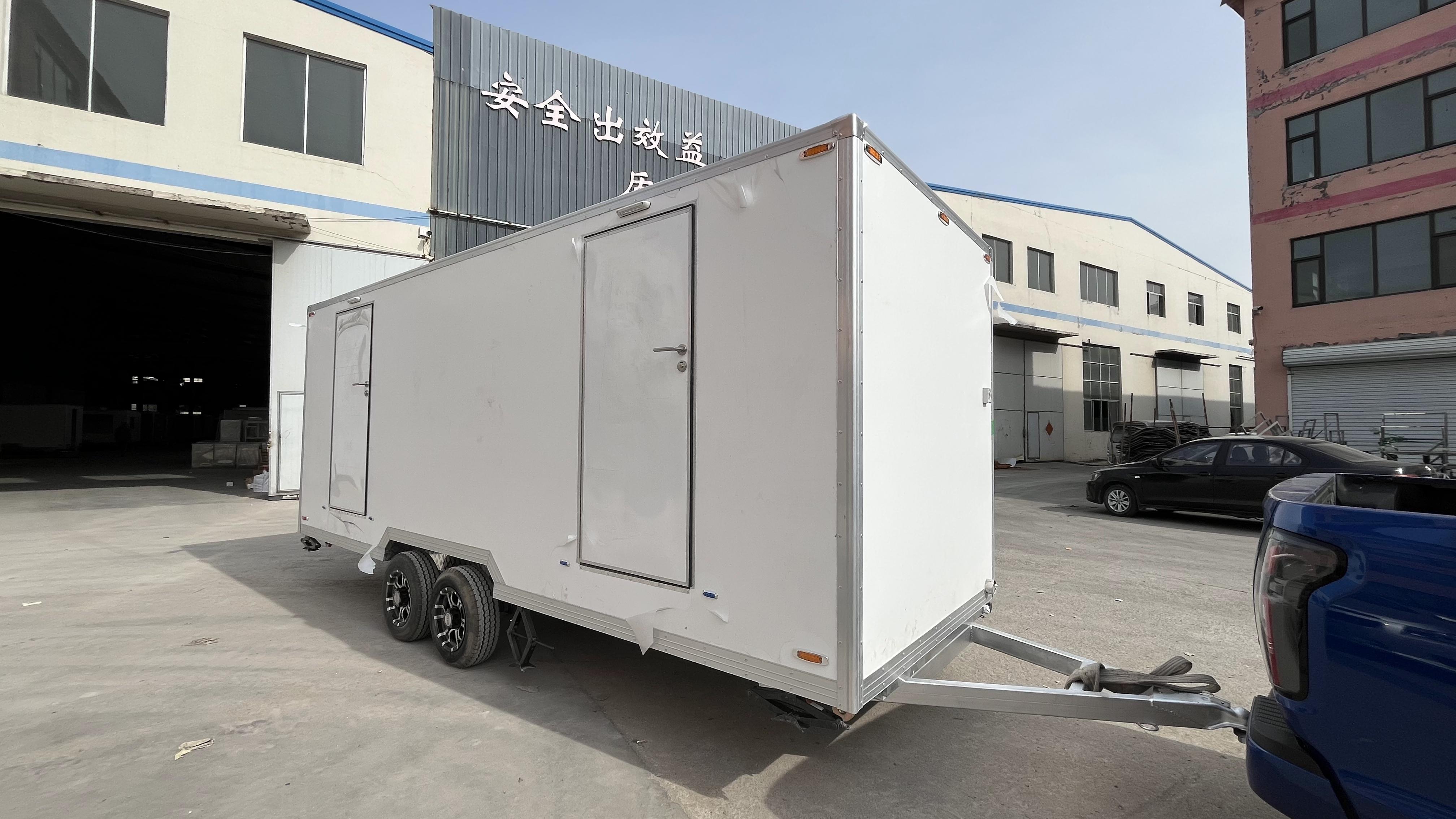 Two portable large white toilets