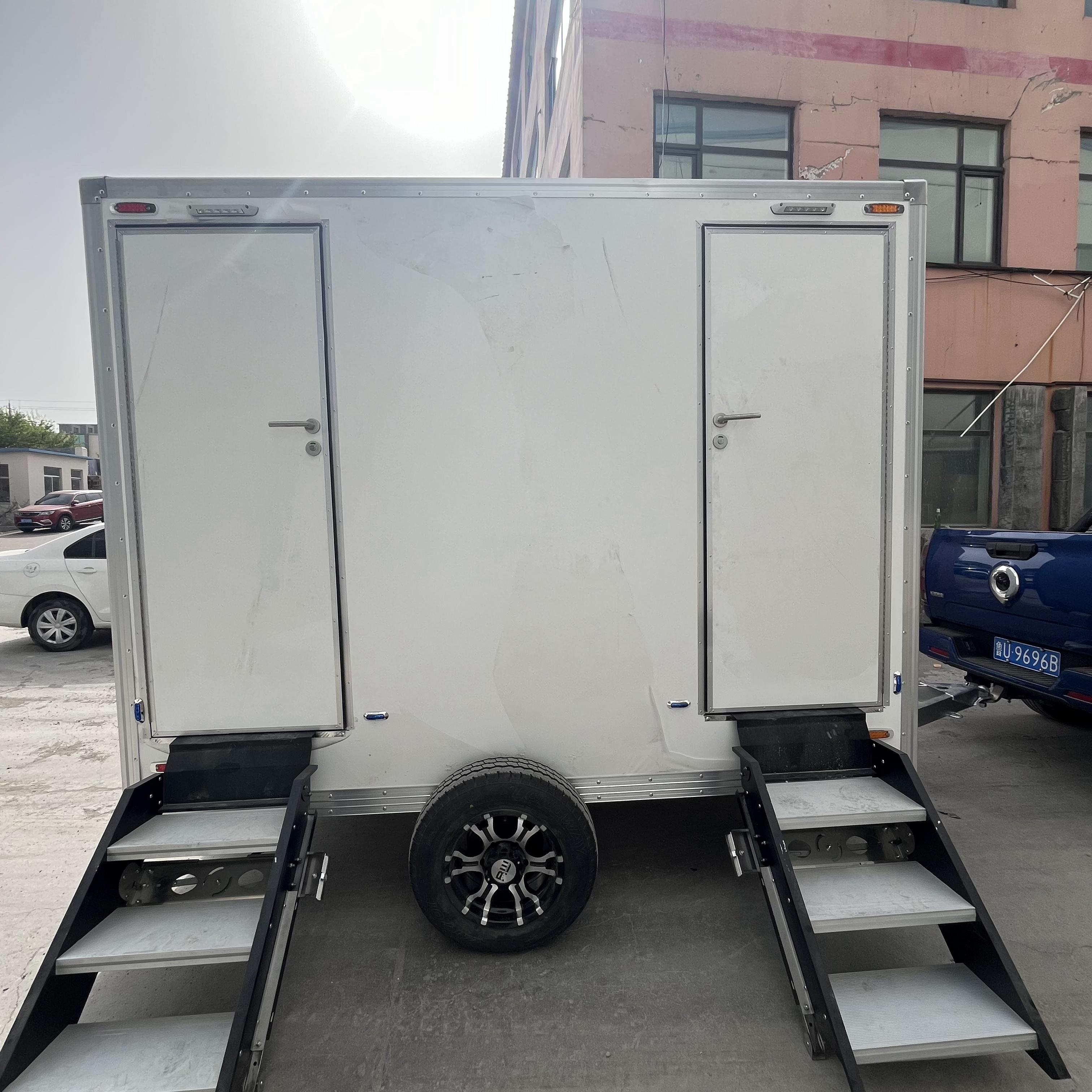 Two white portable toilet trailers: sturdy and durable, easy to move, creating a comfortable toilet experience.
