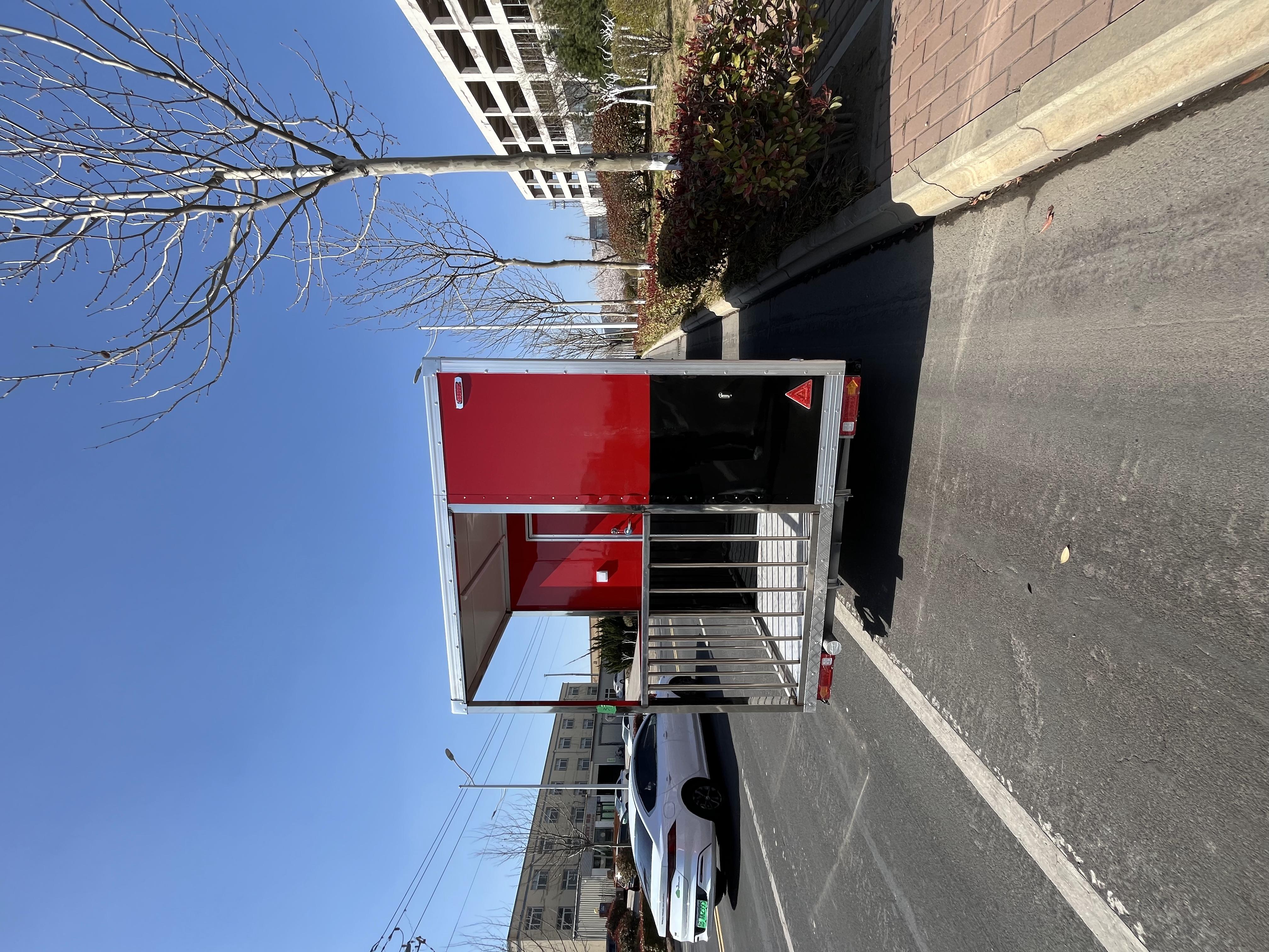 Portable black and red trailer