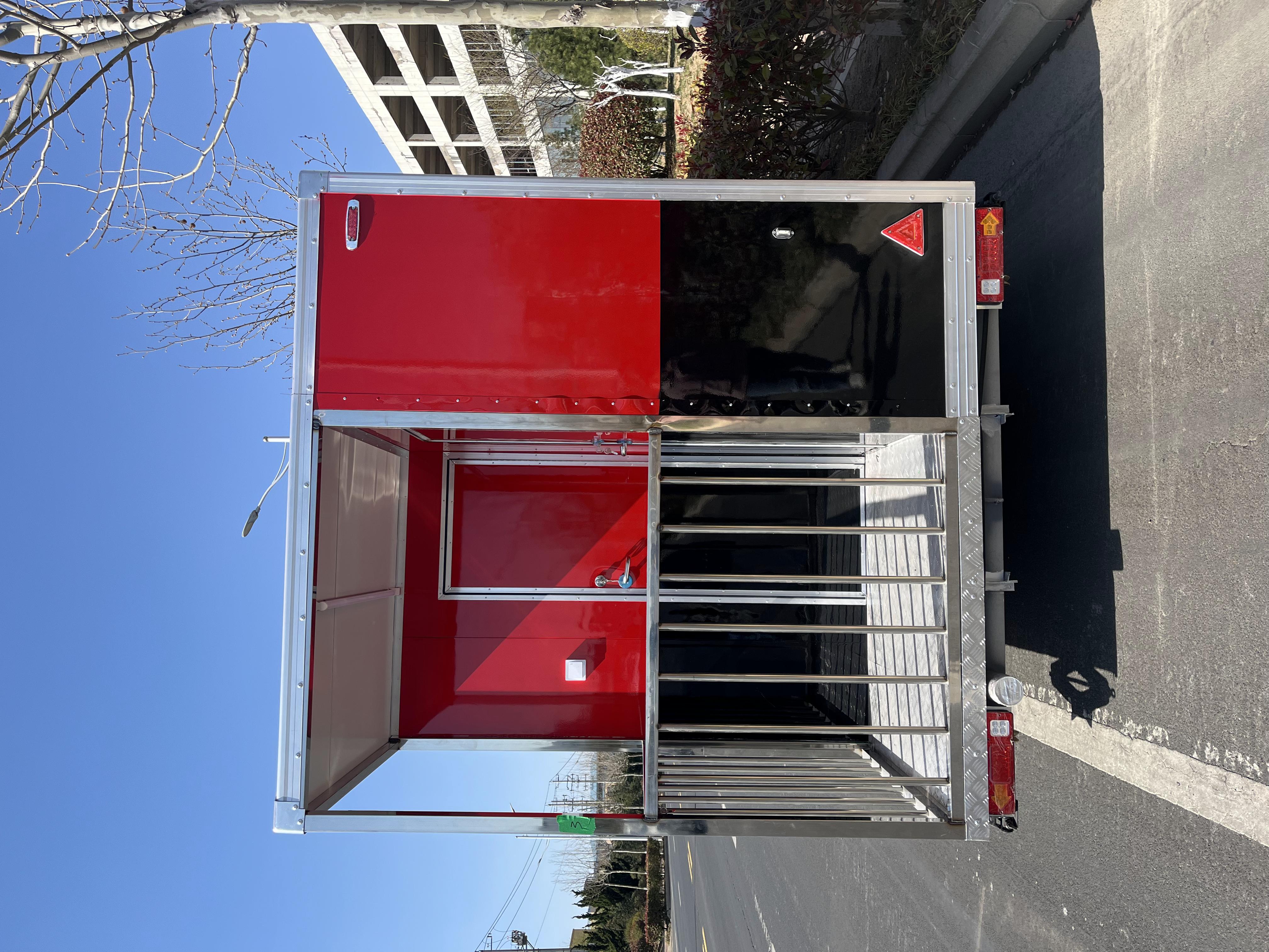Portable black and red trailer