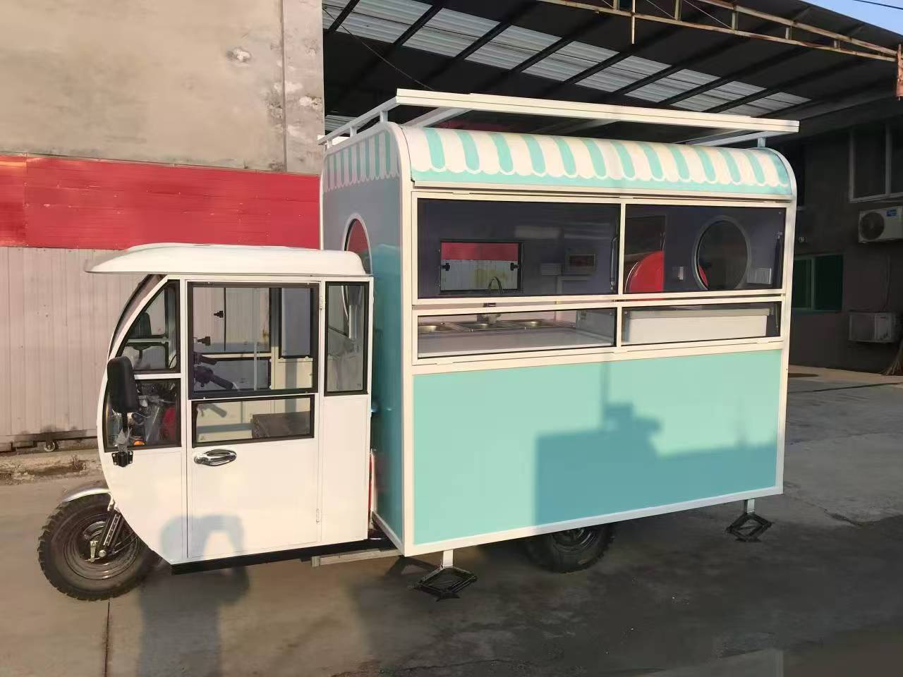 Blue and white three-wheeled food truck: A mobile and refreshing food station