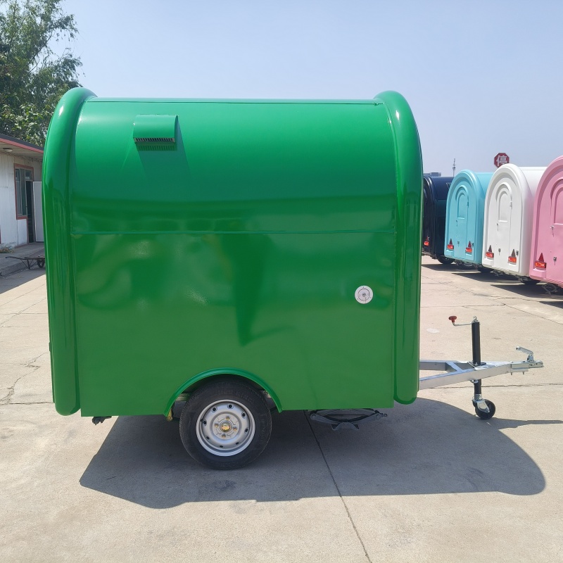 The green small towing food cart is convenient and mobile