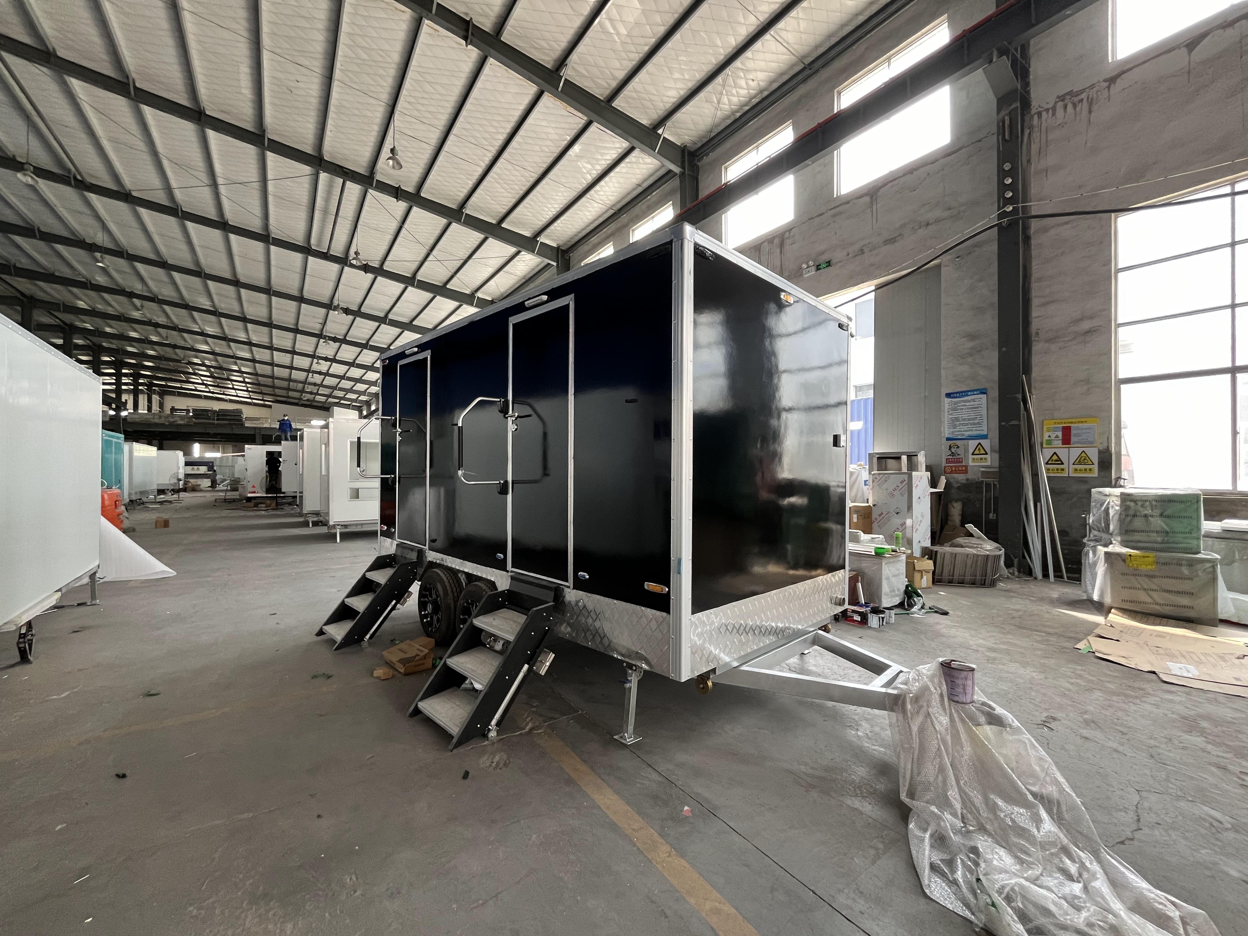 Black two-toilet portable toilet trailer