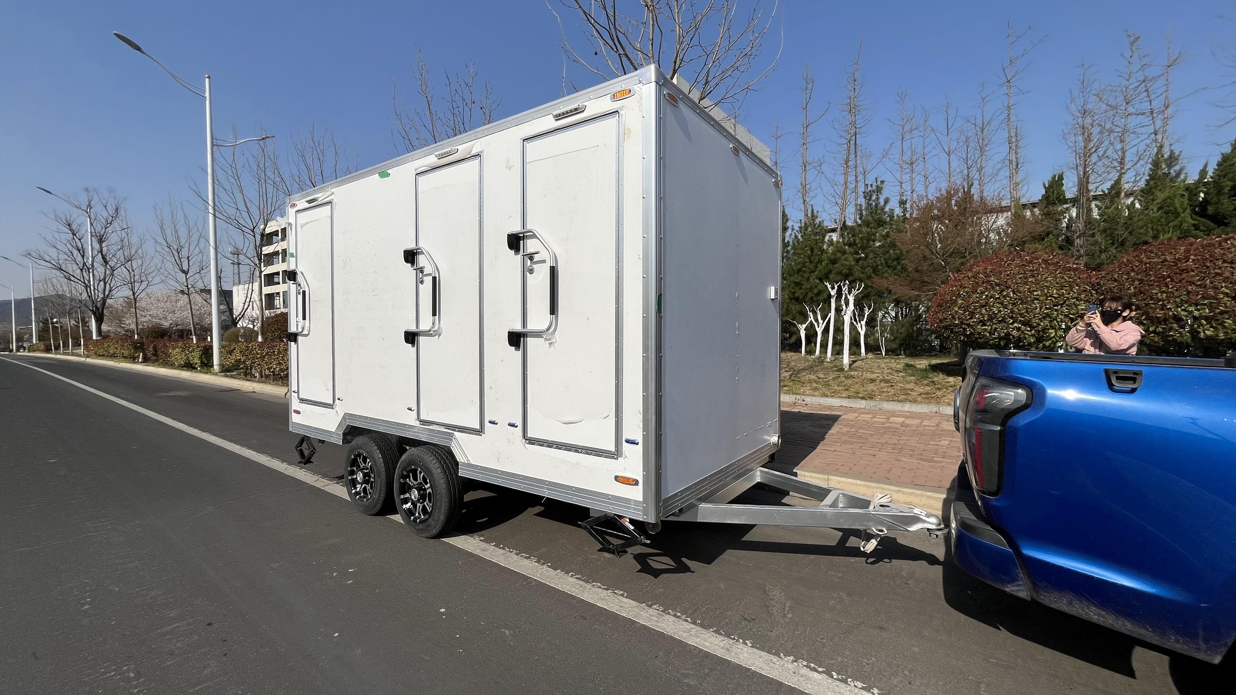 Three white trailer toilets, movable "sanitary fortresses", firmly safeguard cleanliness