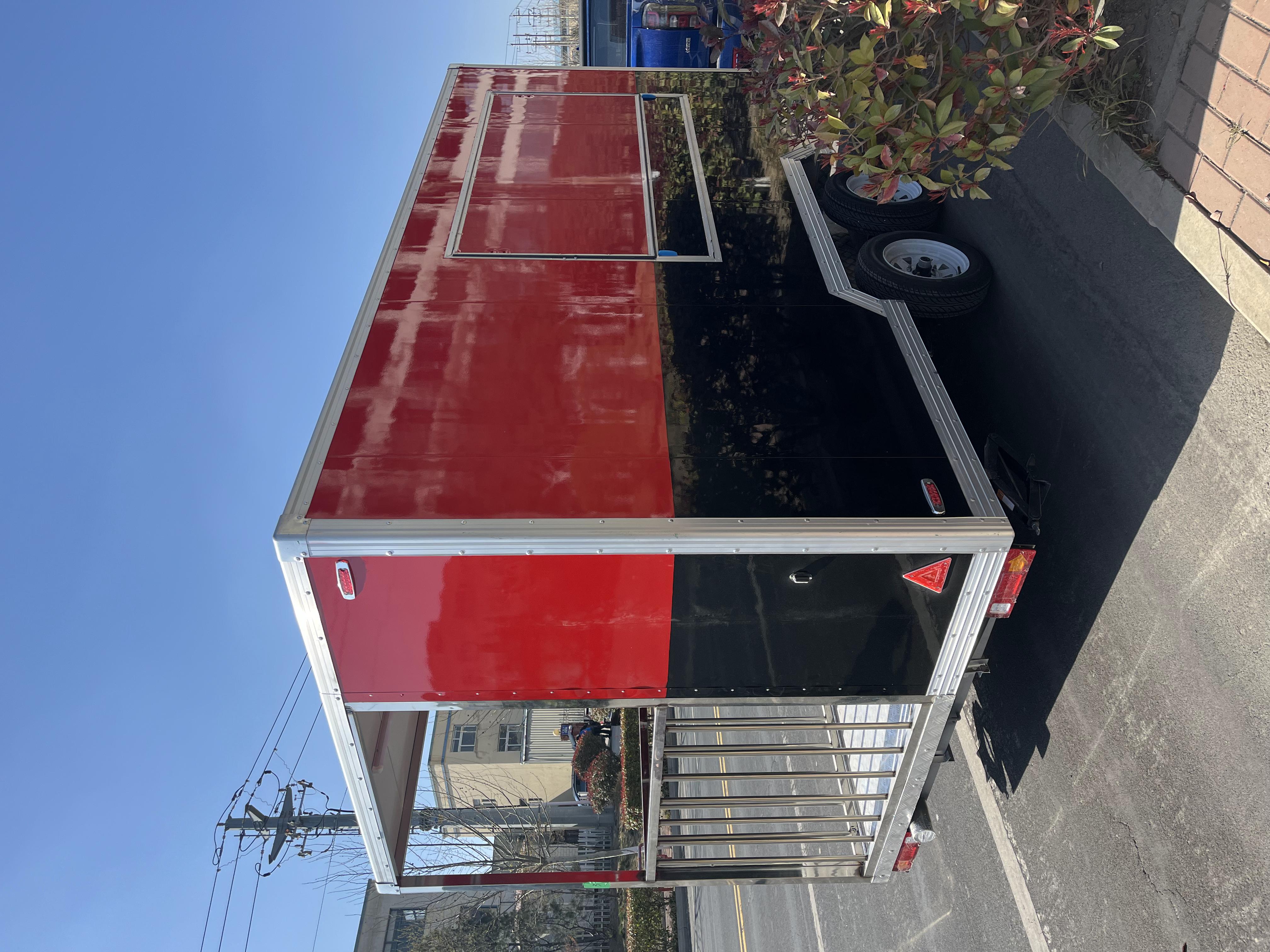 Portable black and red trailer