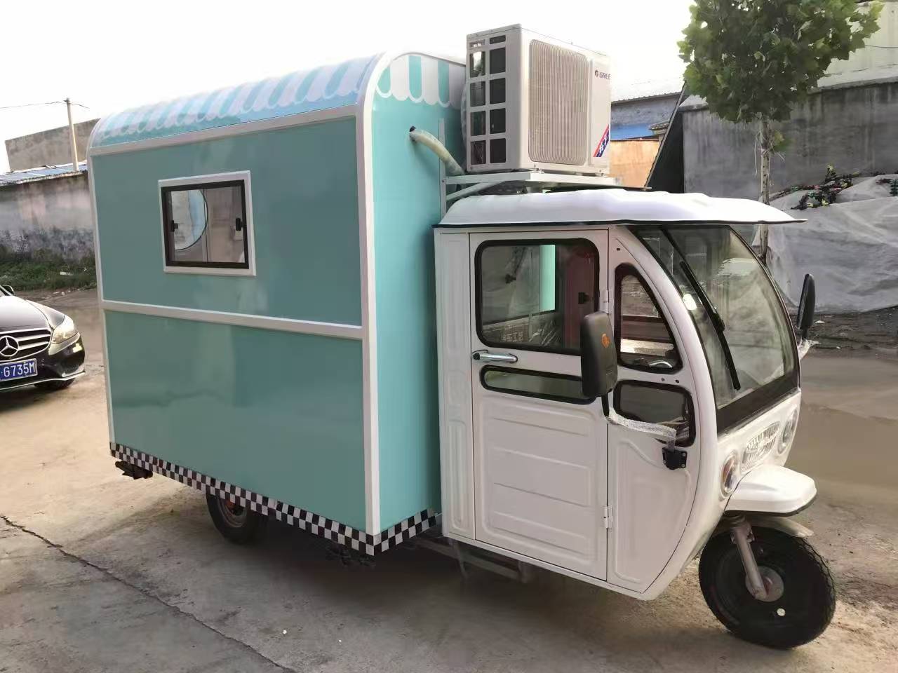 Blue and white three-wheeled food truck: A mobile and refreshing food station