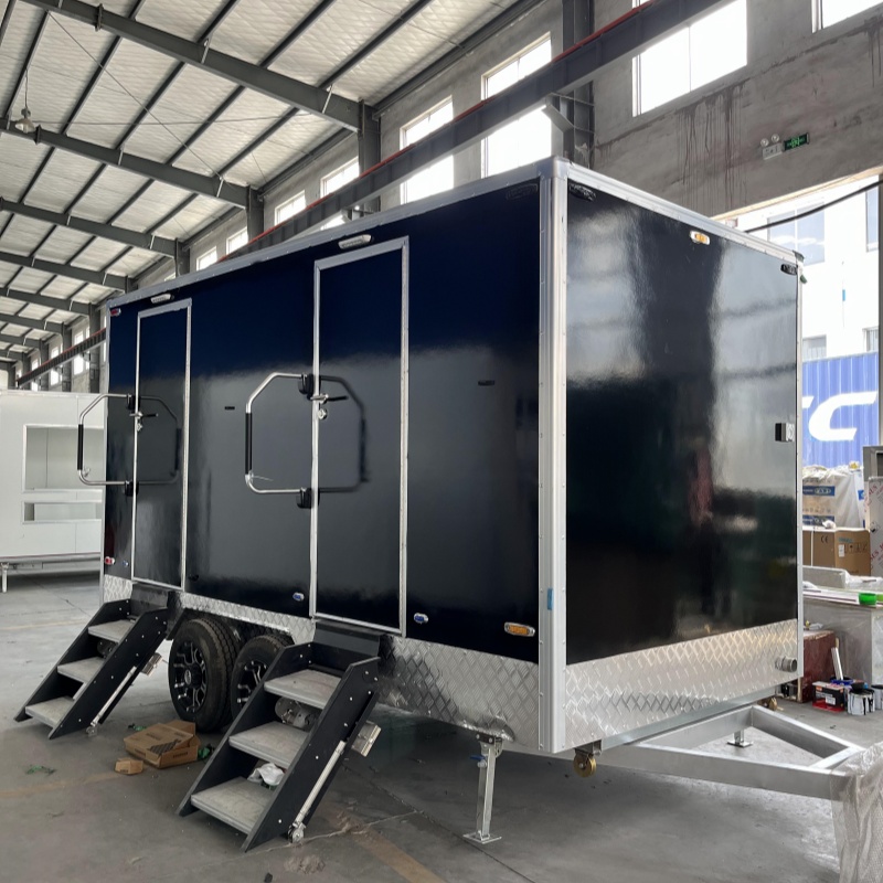 Black two-toilet portable toilet trailer