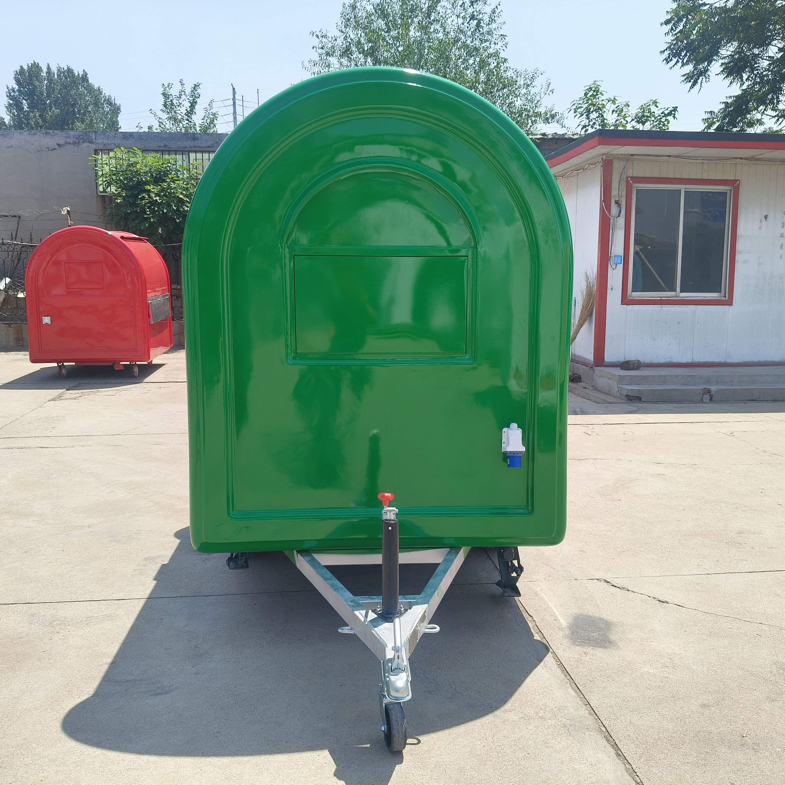The green small towing food cart is convenient and mobile