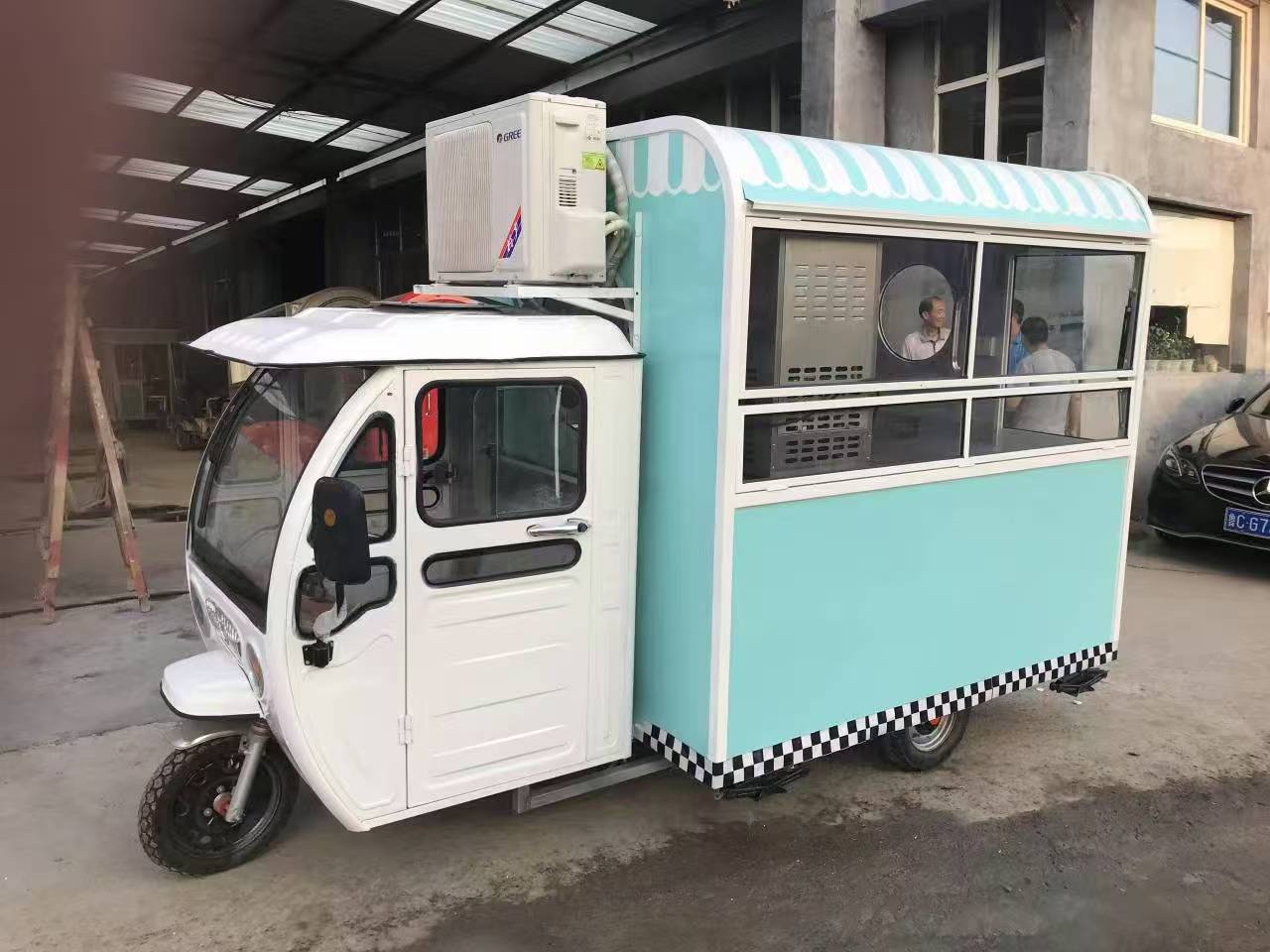 Blue and white three-wheeled food truck: A mobile and refreshing food station