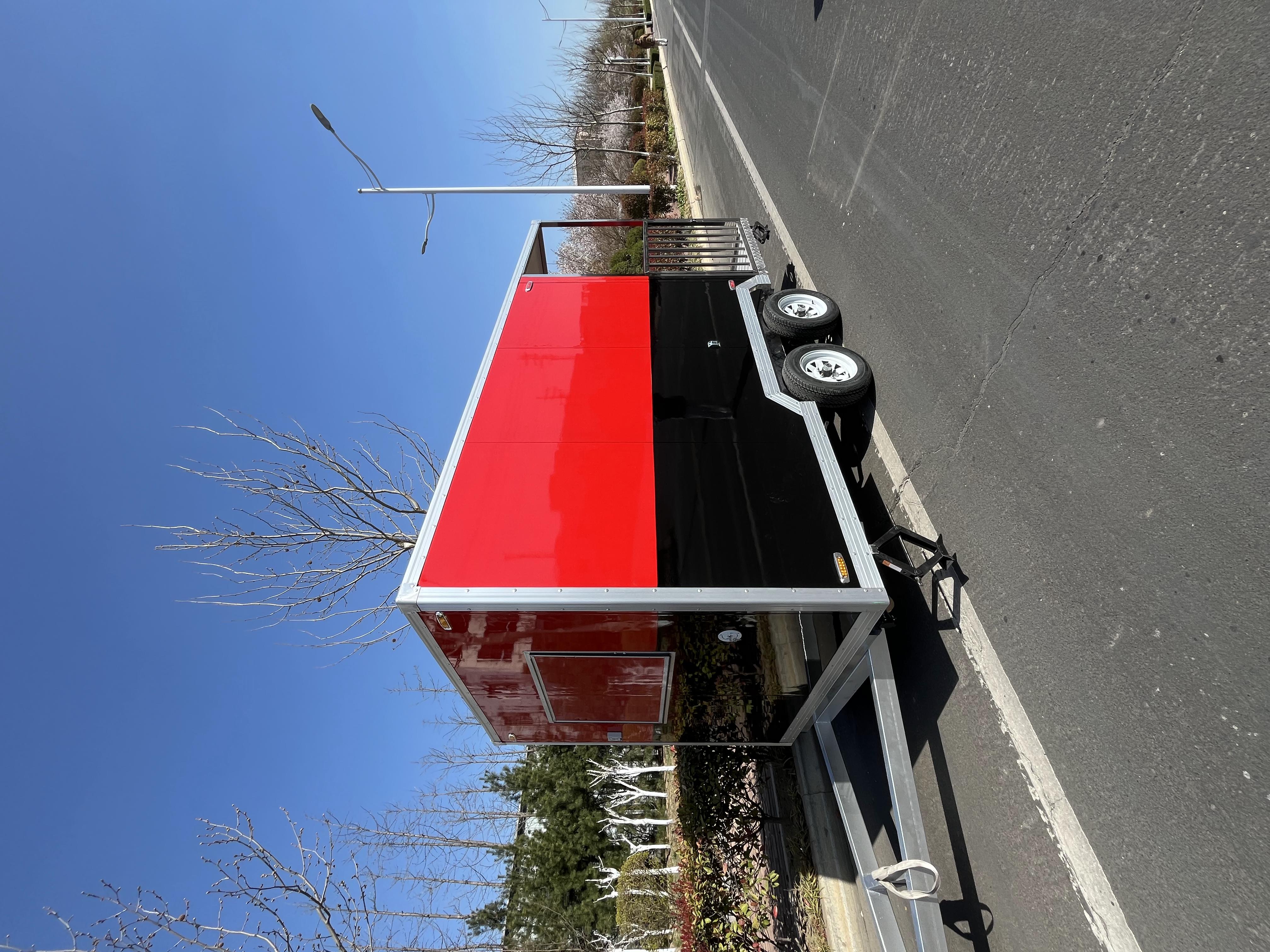 Portable black and red trailer