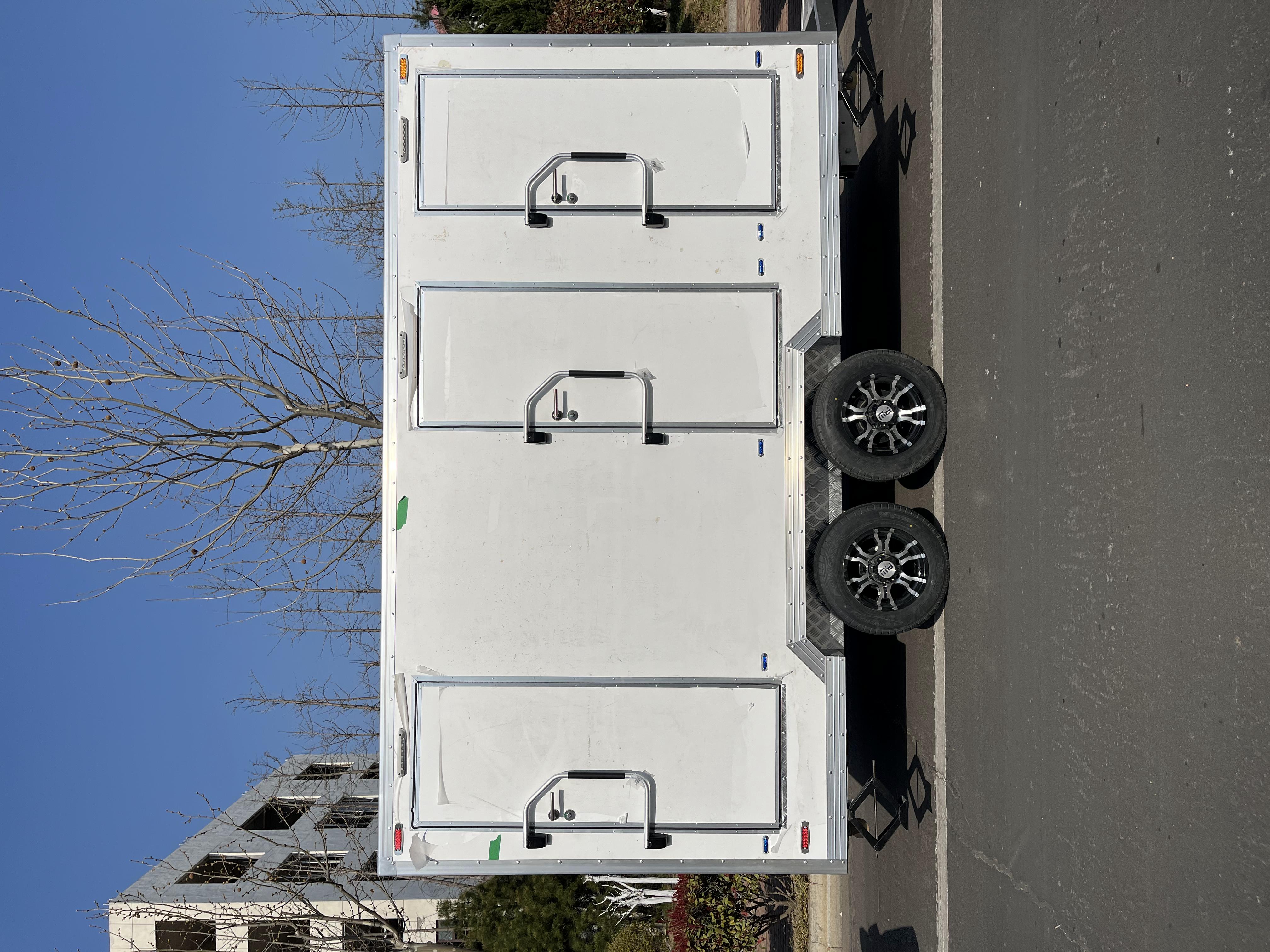 Three white trailer toilets, movable "sanitary fortresses", firmly safeguard cleanliness