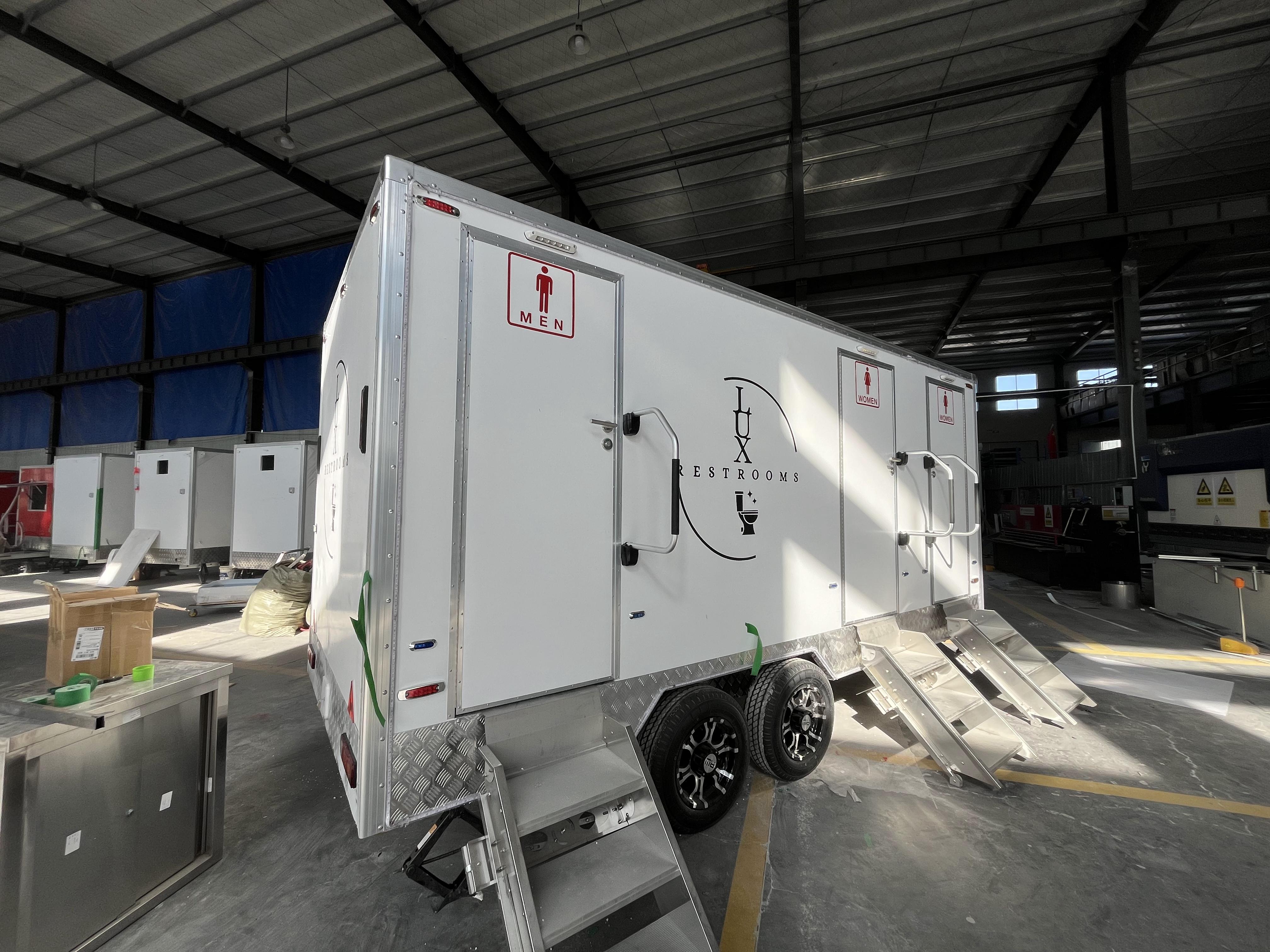 Three mobile toilet trailers with stickers, Instagram-style painted bathroom vehicles, commercial event check-in spots, and quick deployment in a towed manner