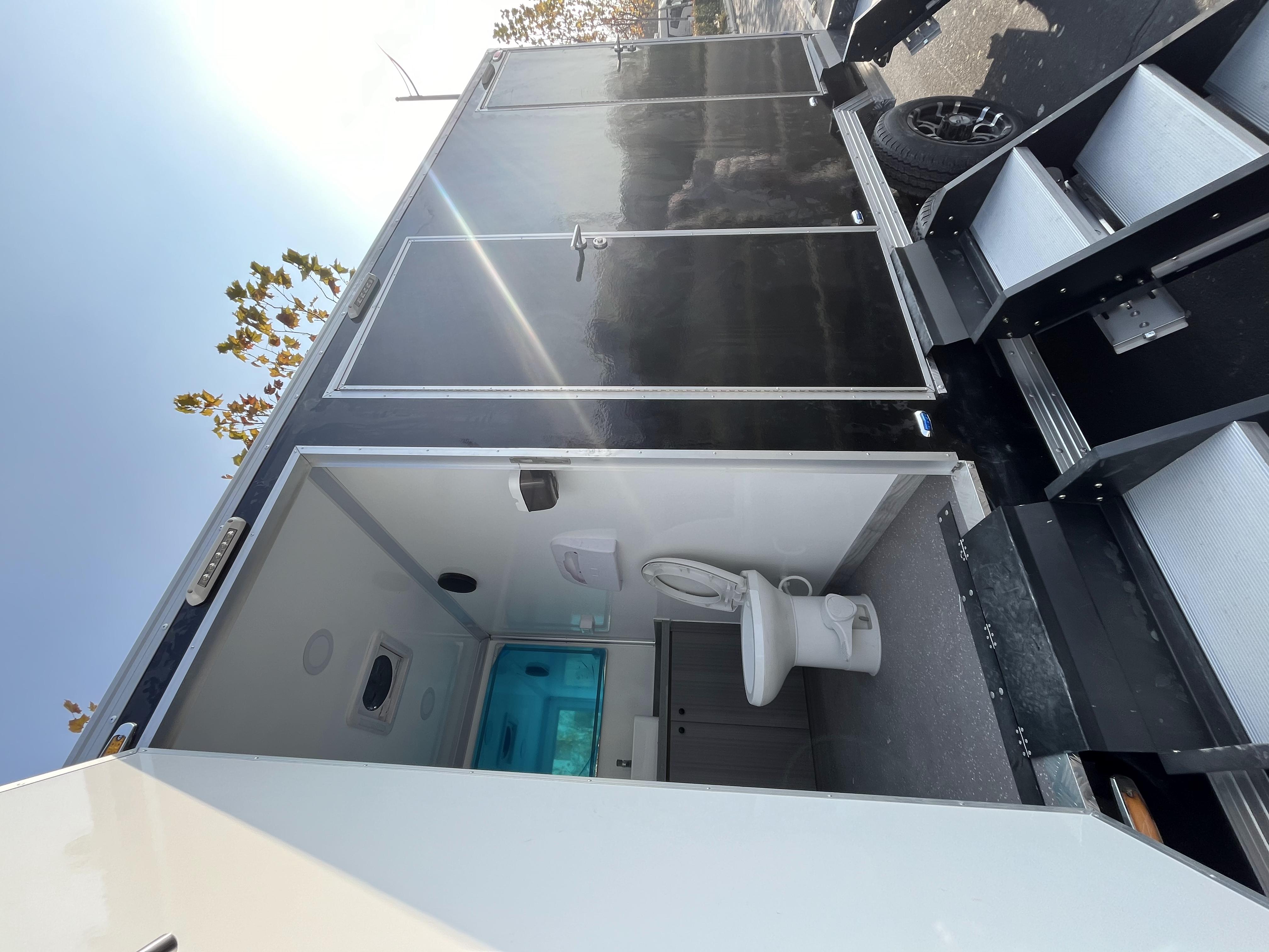 Black trailer-mounted mobile toilet, meeting the needs of various scenarios