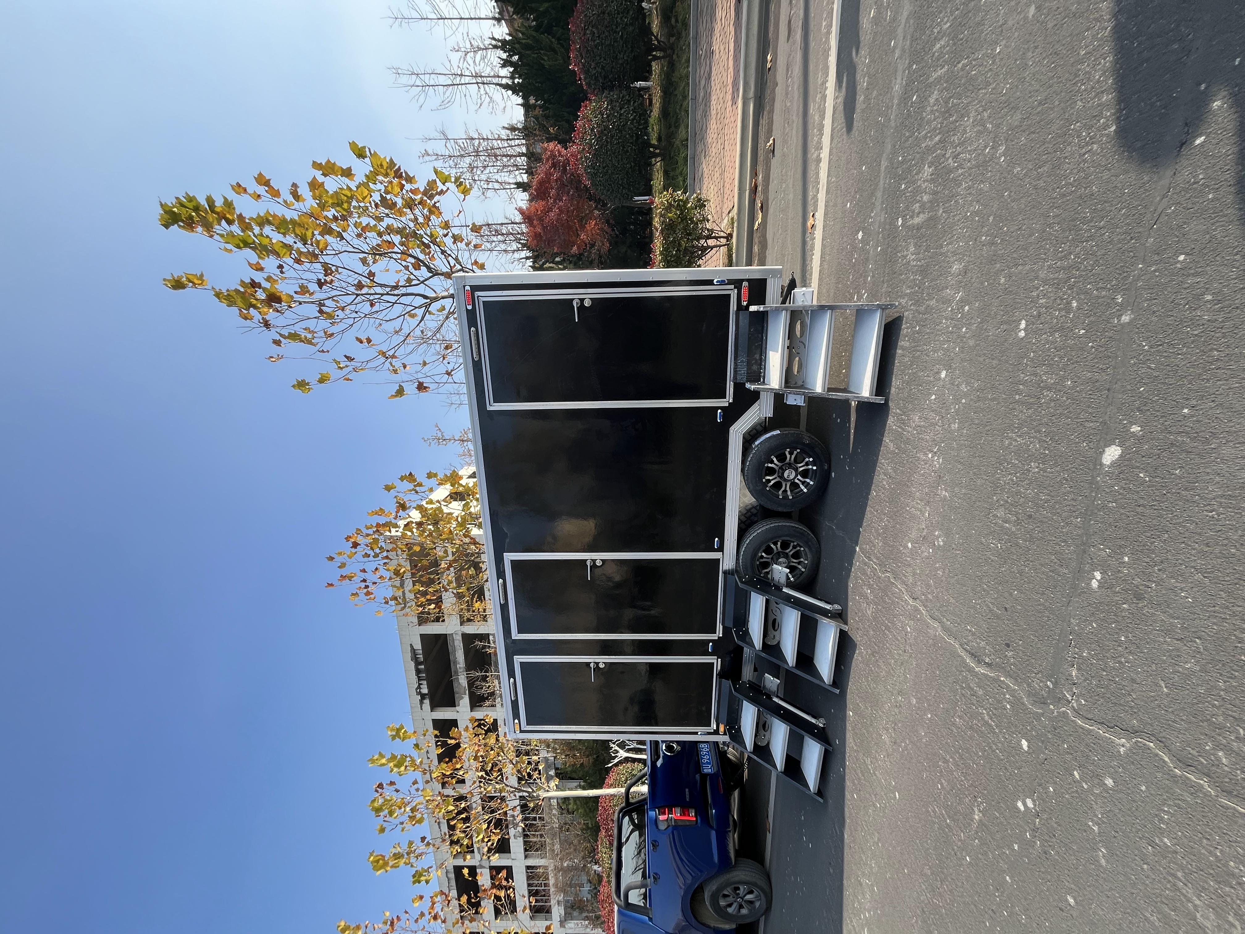 Black trailer-mounted mobile toilet, meeting the needs of various scenarios