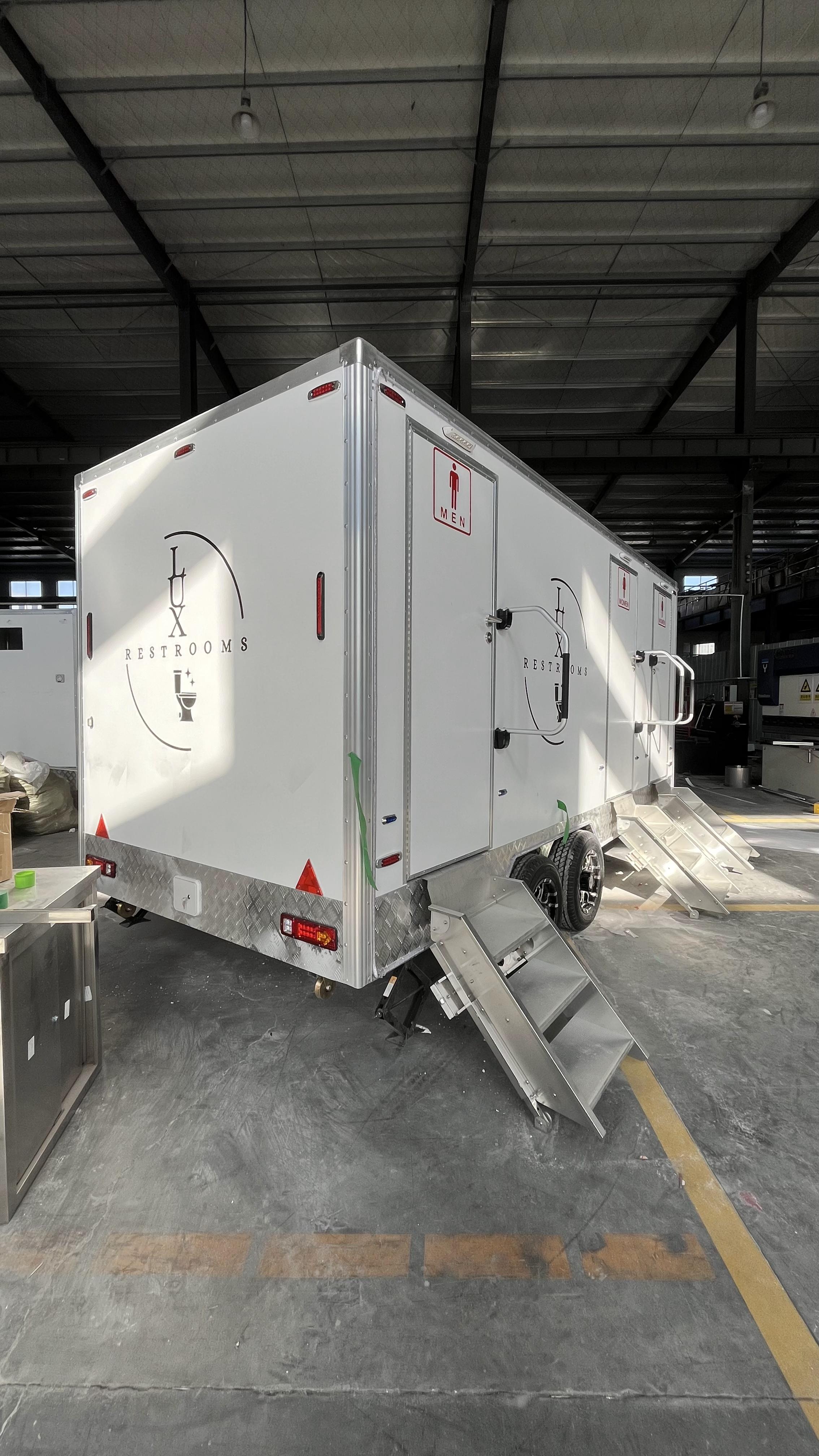 Three mobile toilet trailers with stickers, Instagram-style painted bathroom vehicles, commercial event check-in spots, and quick deployment in a towed manner