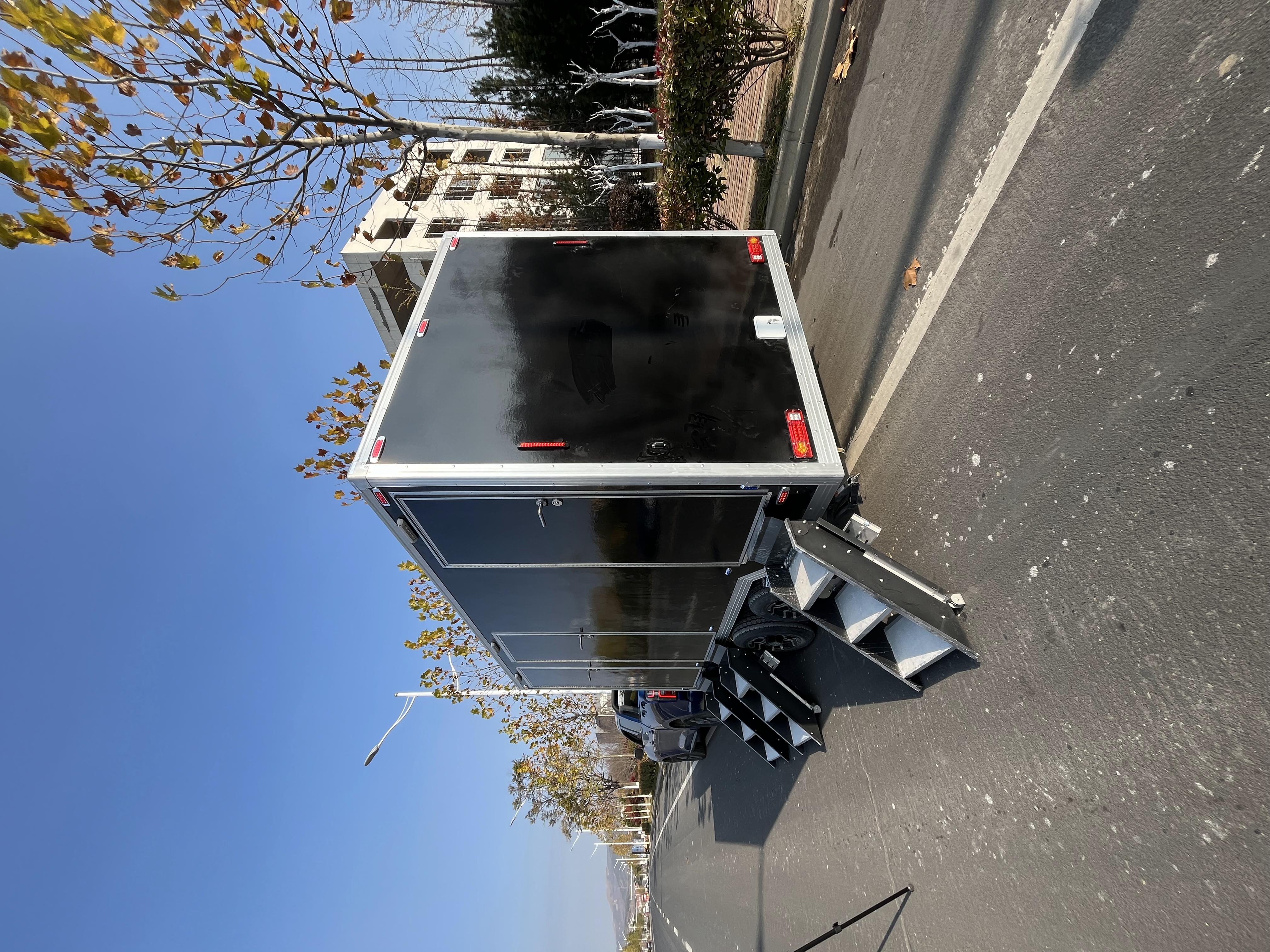 Black trailer-mounted mobile toilet, meeting the needs of various scenarios