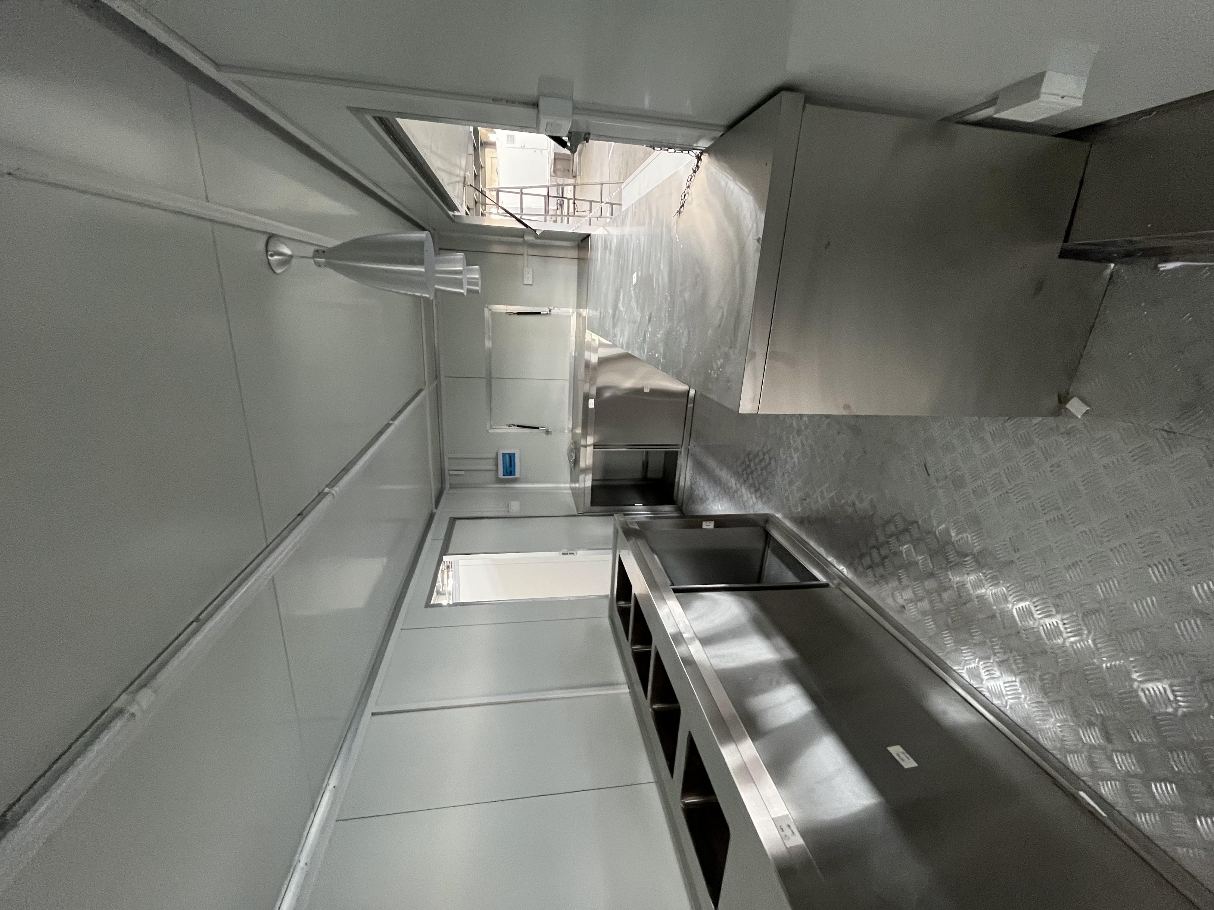 The fashionable blue pavilion food truck creates a trendy street scene
