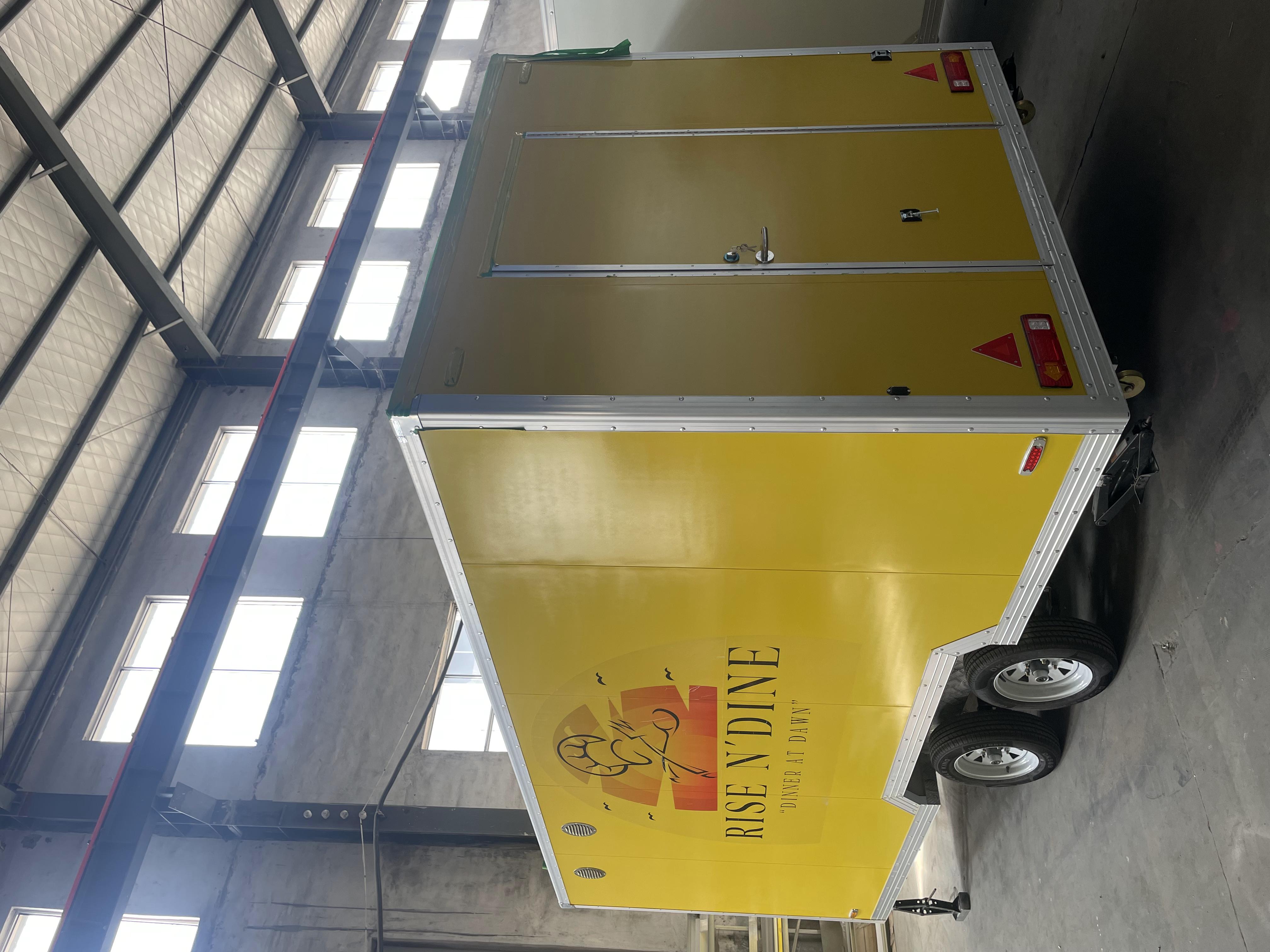 "RISE N DINE" yellow food cart mobile catering operation equipment