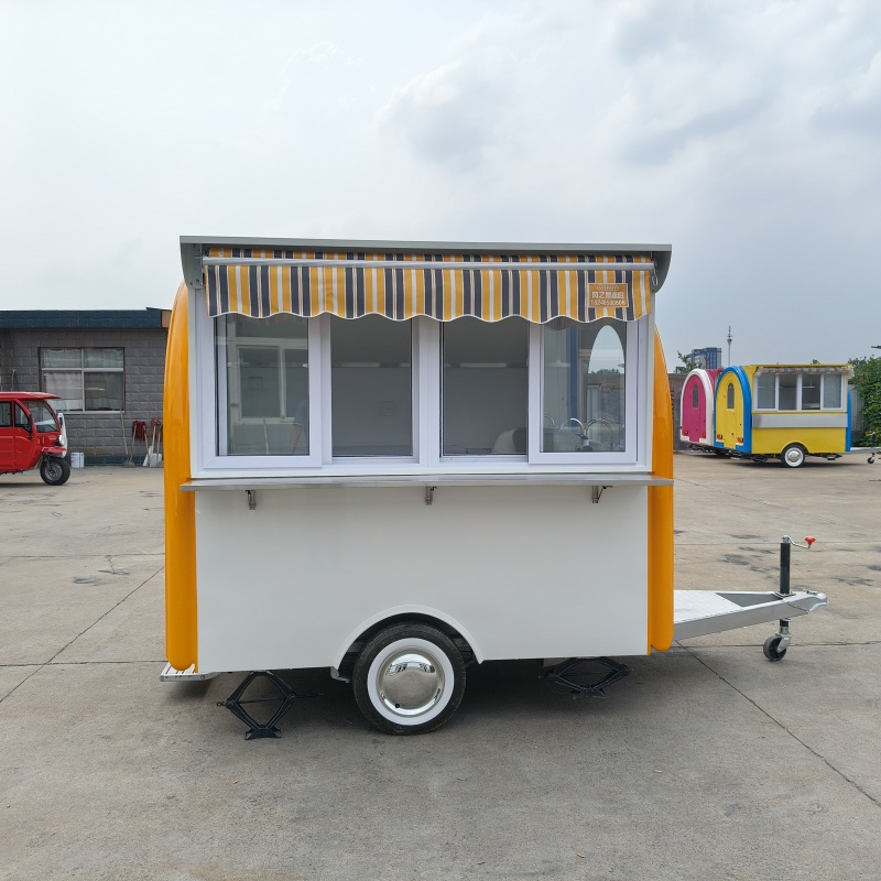 The yellow and white color scheme fashionable food truck is a mobile catering business start-up equipment and a convenient mobile vending cart