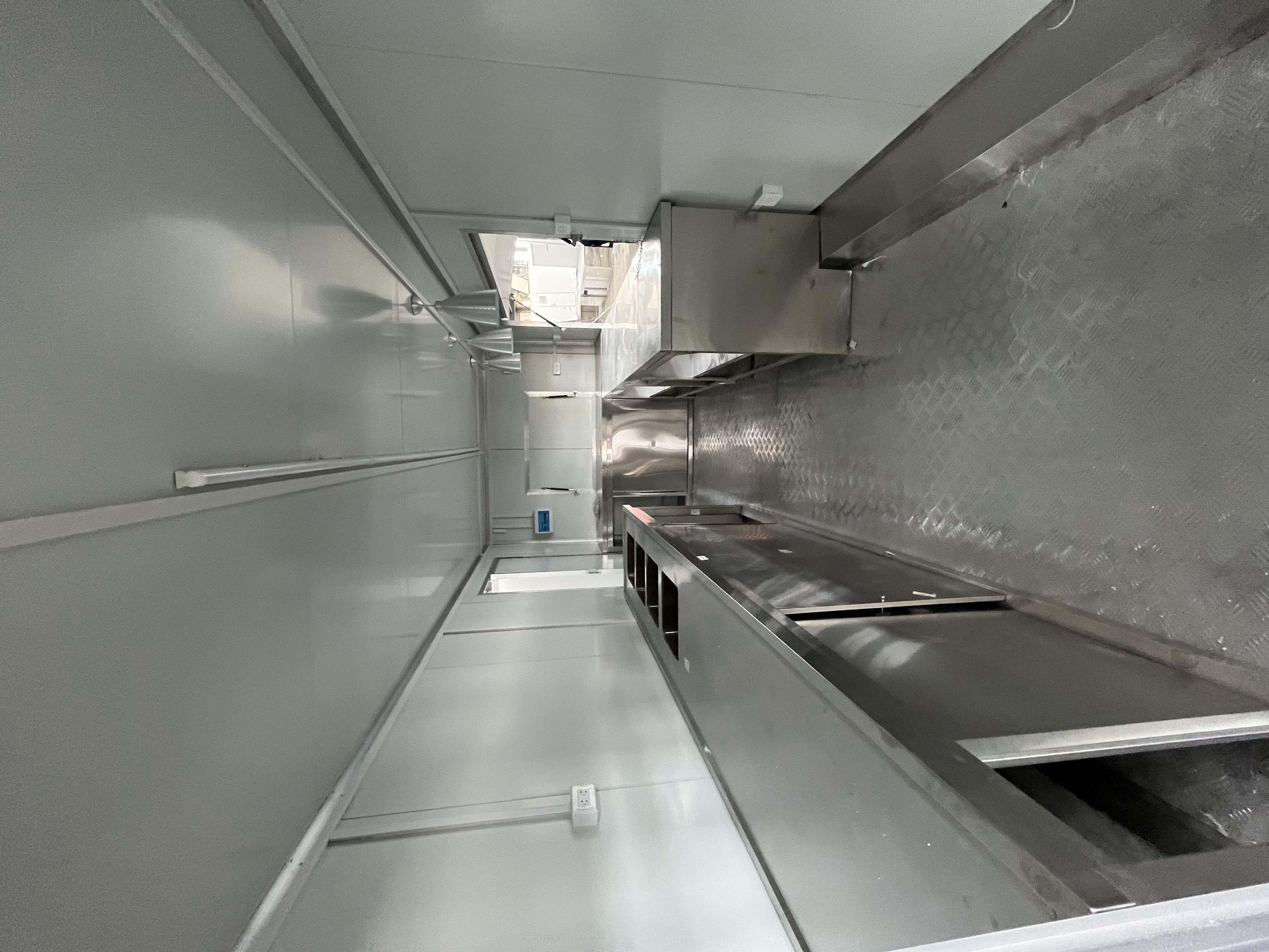 The fashionable blue pavilion food truck creates a trendy street scene