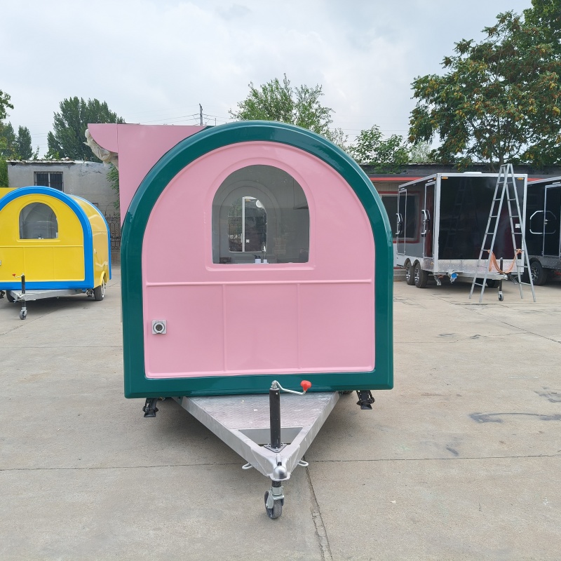 The pink and green circular food truck, a mobile business food truck, is a popular food check-in stall