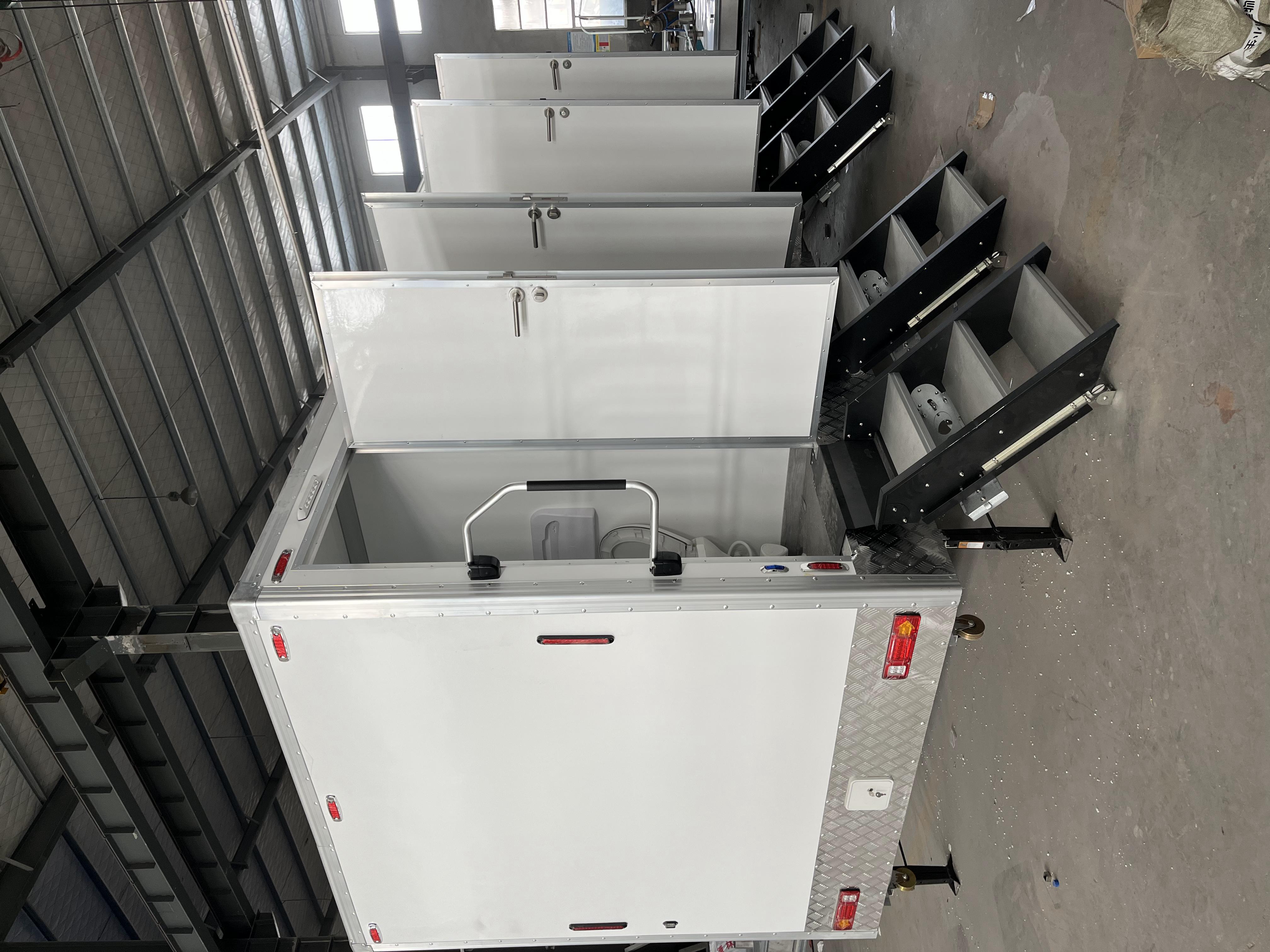 Four trailer-mounted mobile toilets, the preferred choice for temporary toilet use in tourist attractions
