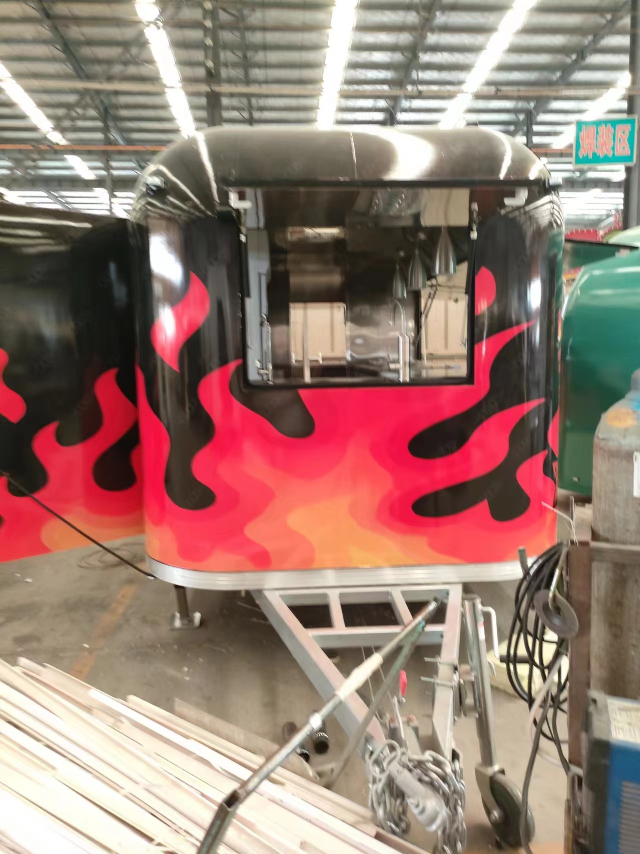 The classic black and red color scheme with patterns food truck is a must-have for mobile shops