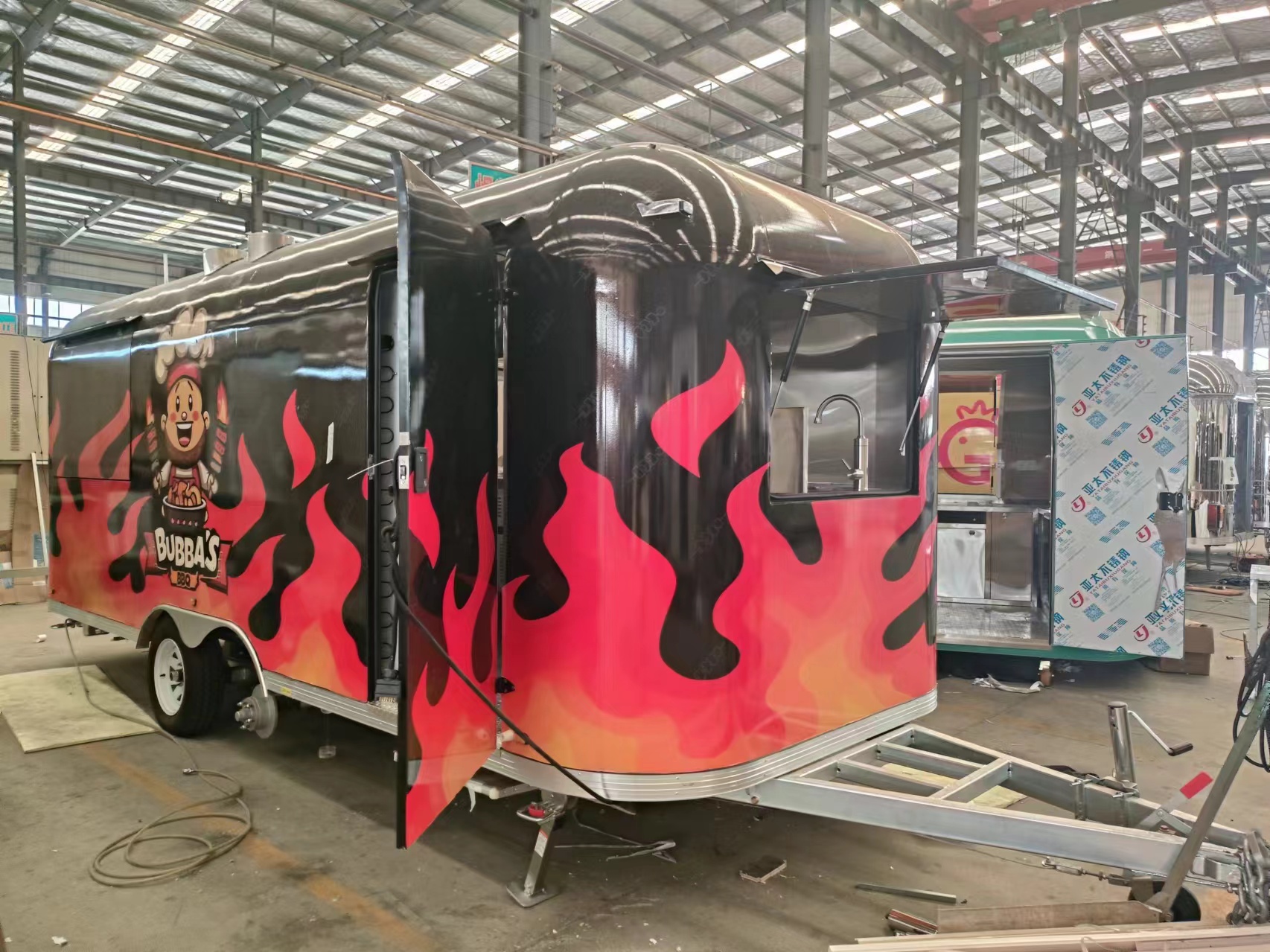 The classic black and red color scheme with patterns food truck is a must-have for mobile shops