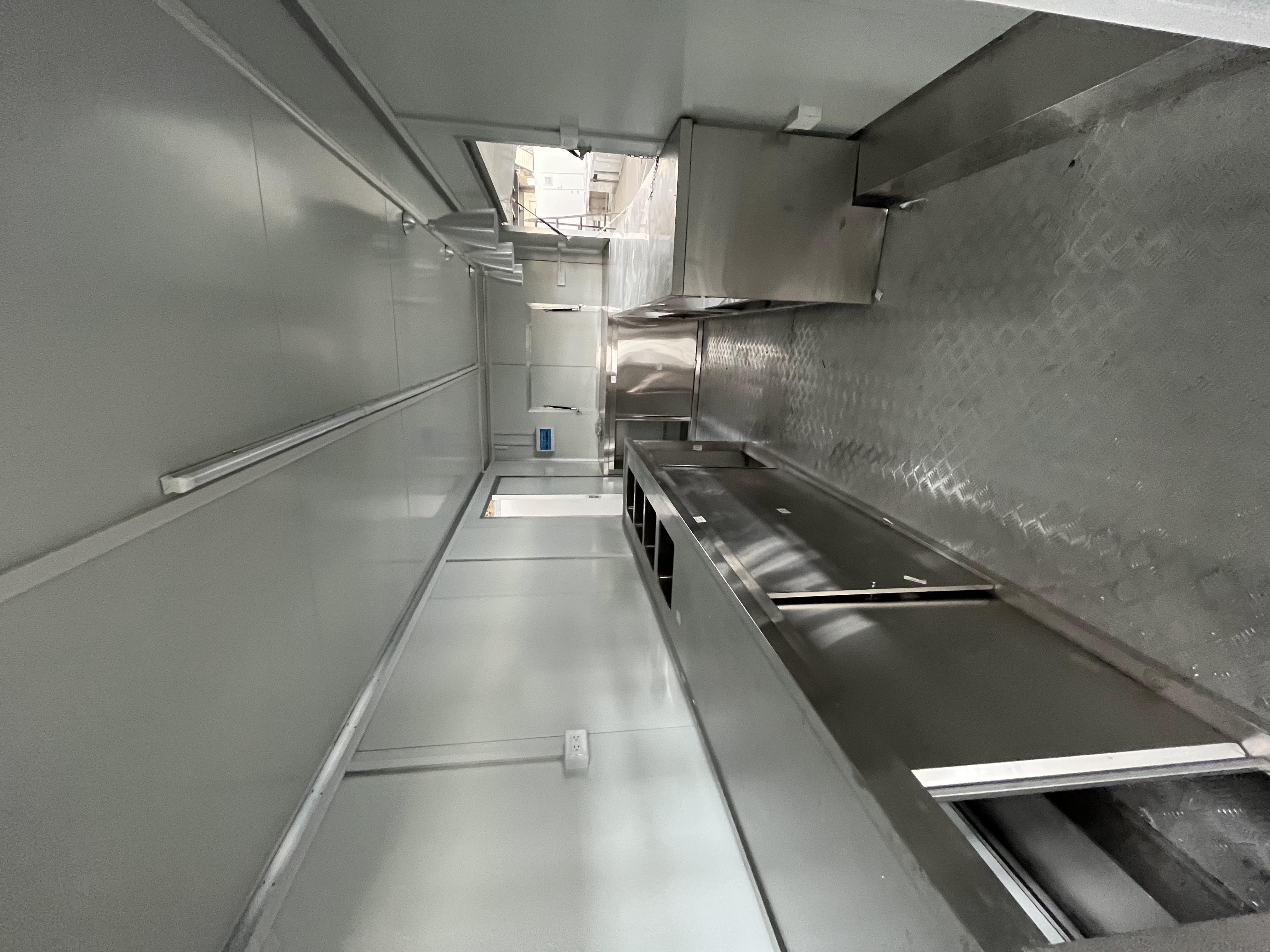 The fashionable blue pavilion food truck creates a trendy street scene