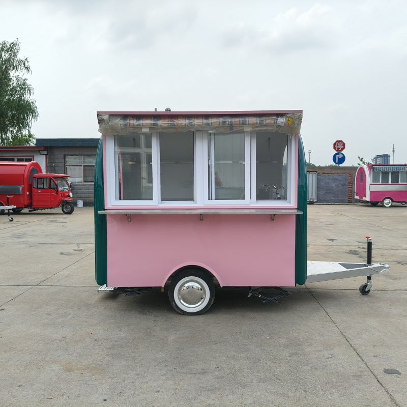 The pink and green circular food truck, a mobile business food truck, is a popular food check-in stall