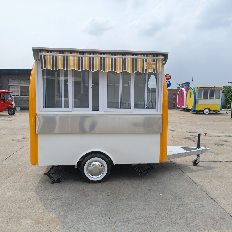 The yellow and white color scheme fashionable food truck is a mobile catering business start-up equipment and a convenient mobile vending cart