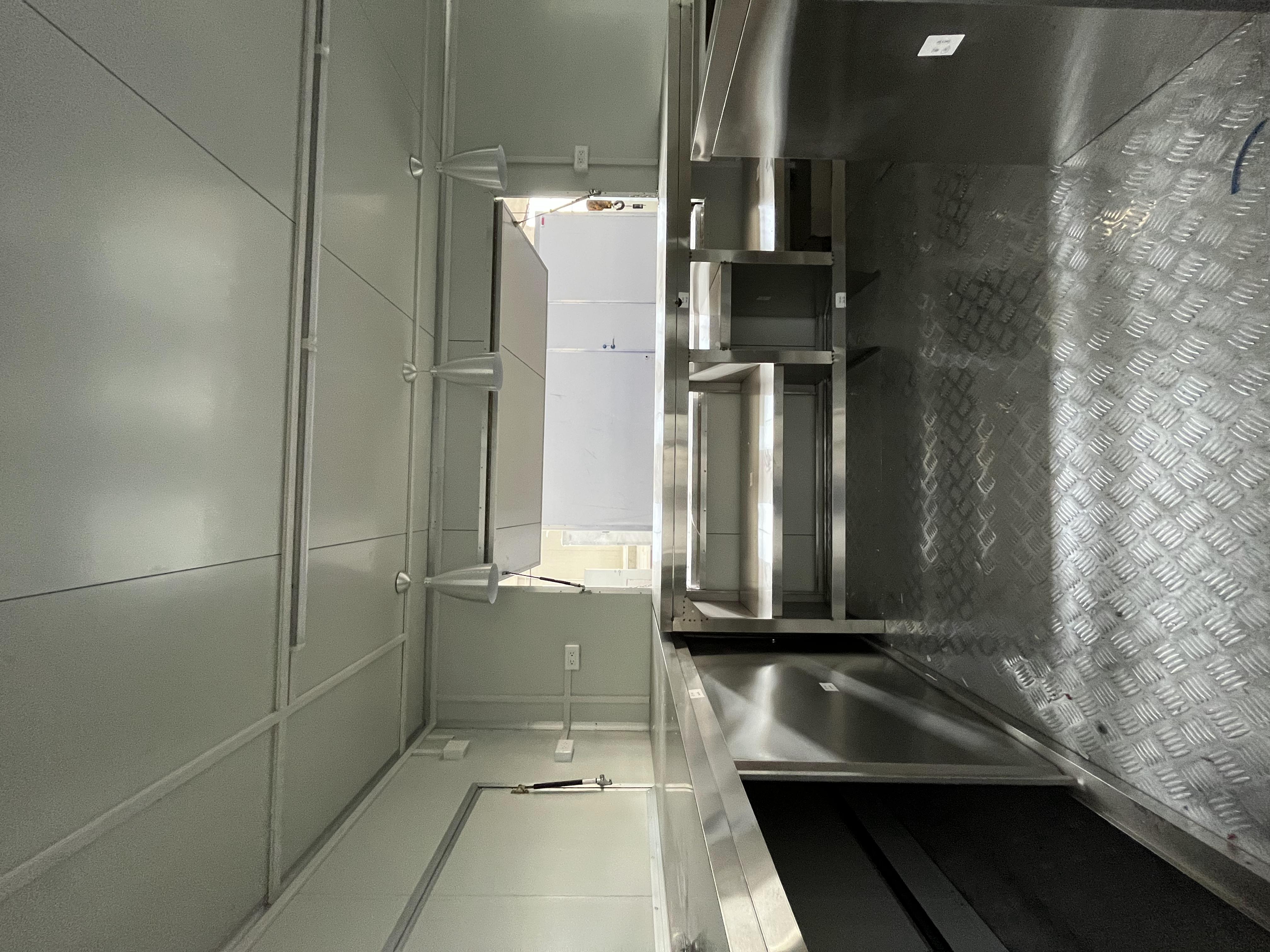 The fashionable blue pavilion food truck creates a trendy street scene