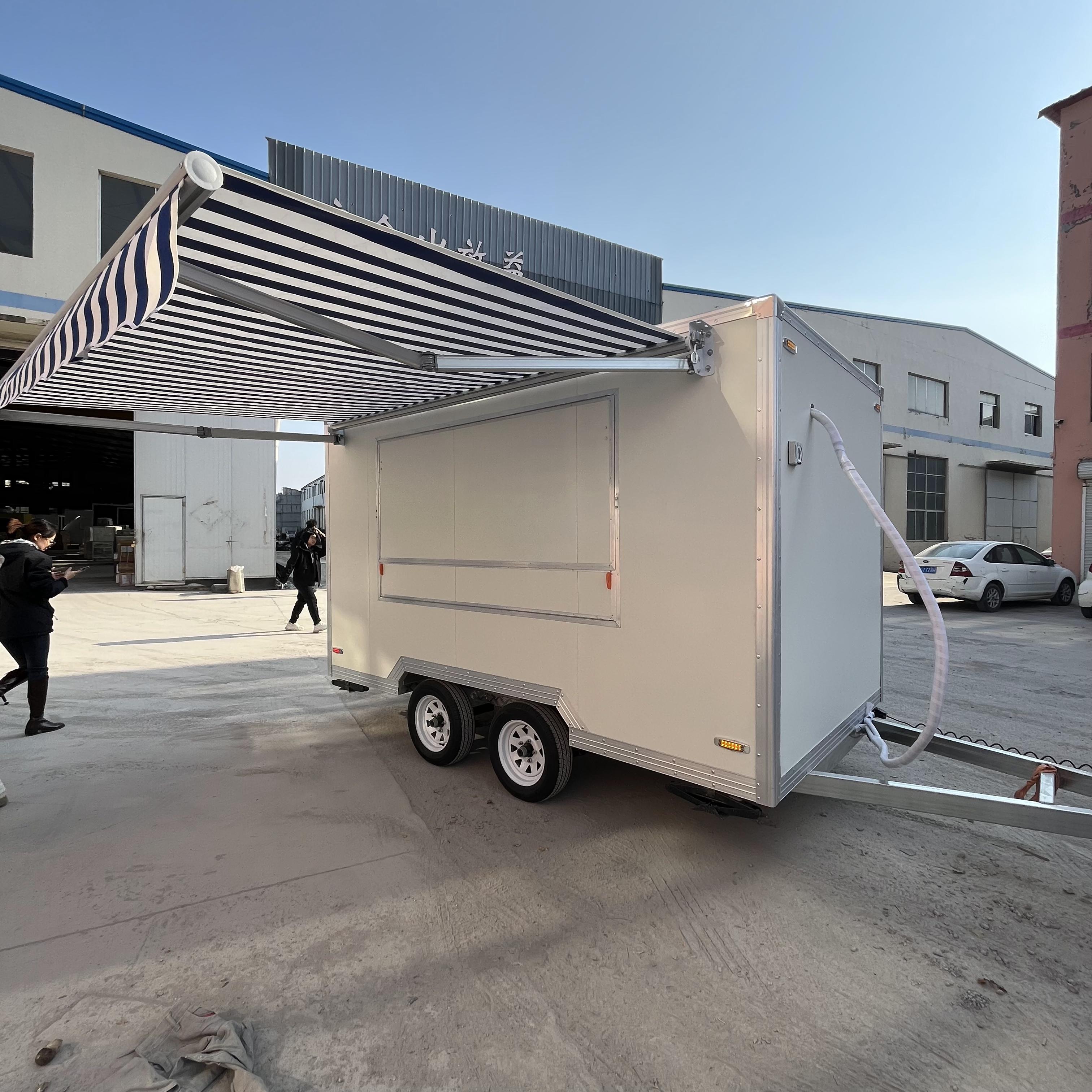 A mobile food truck with a sunshade, a towable mobile store for business start-up and stall setting, catering vehicle.
