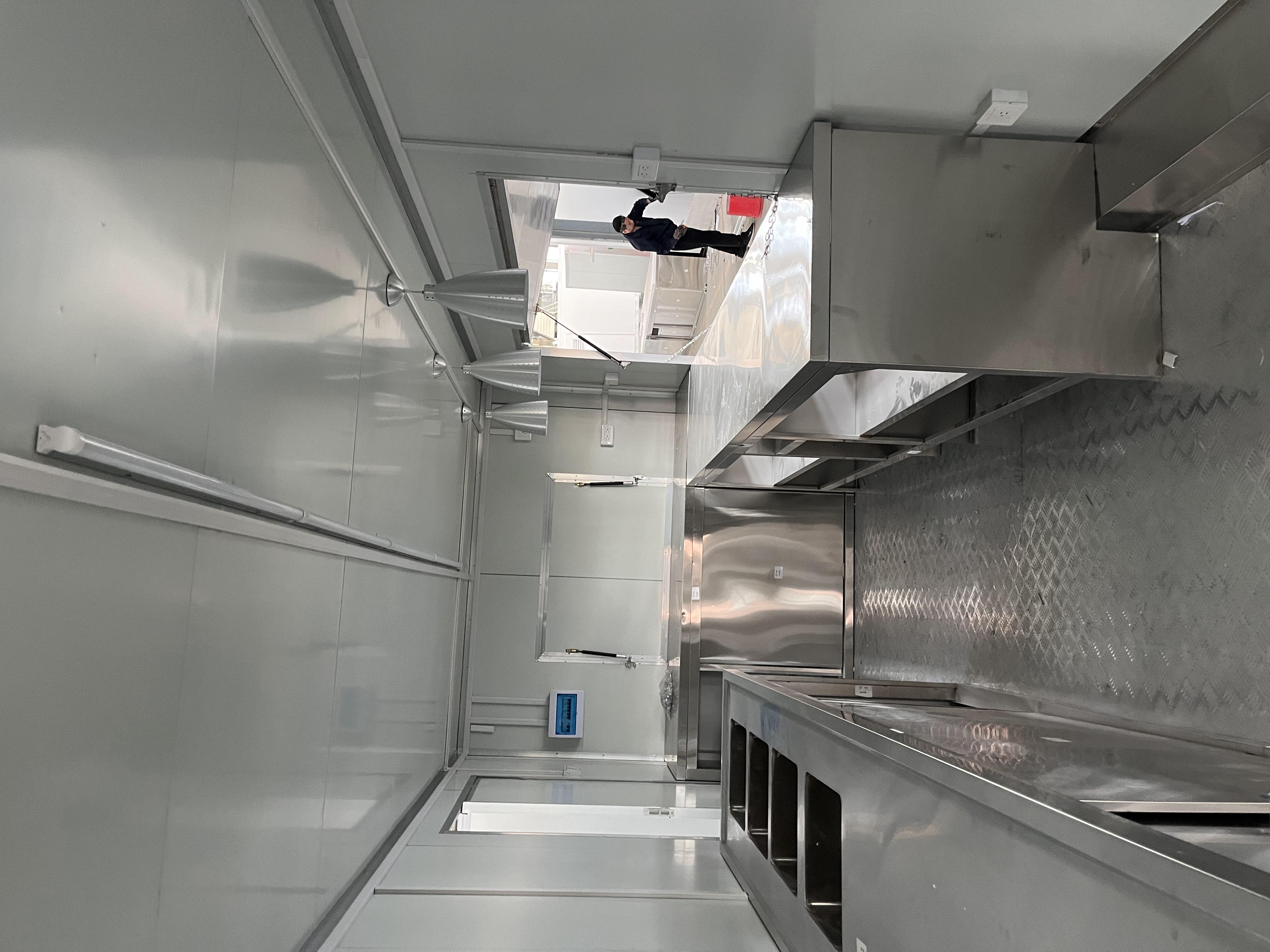 The fashionable blue pavilion food truck creates a trendy street scene