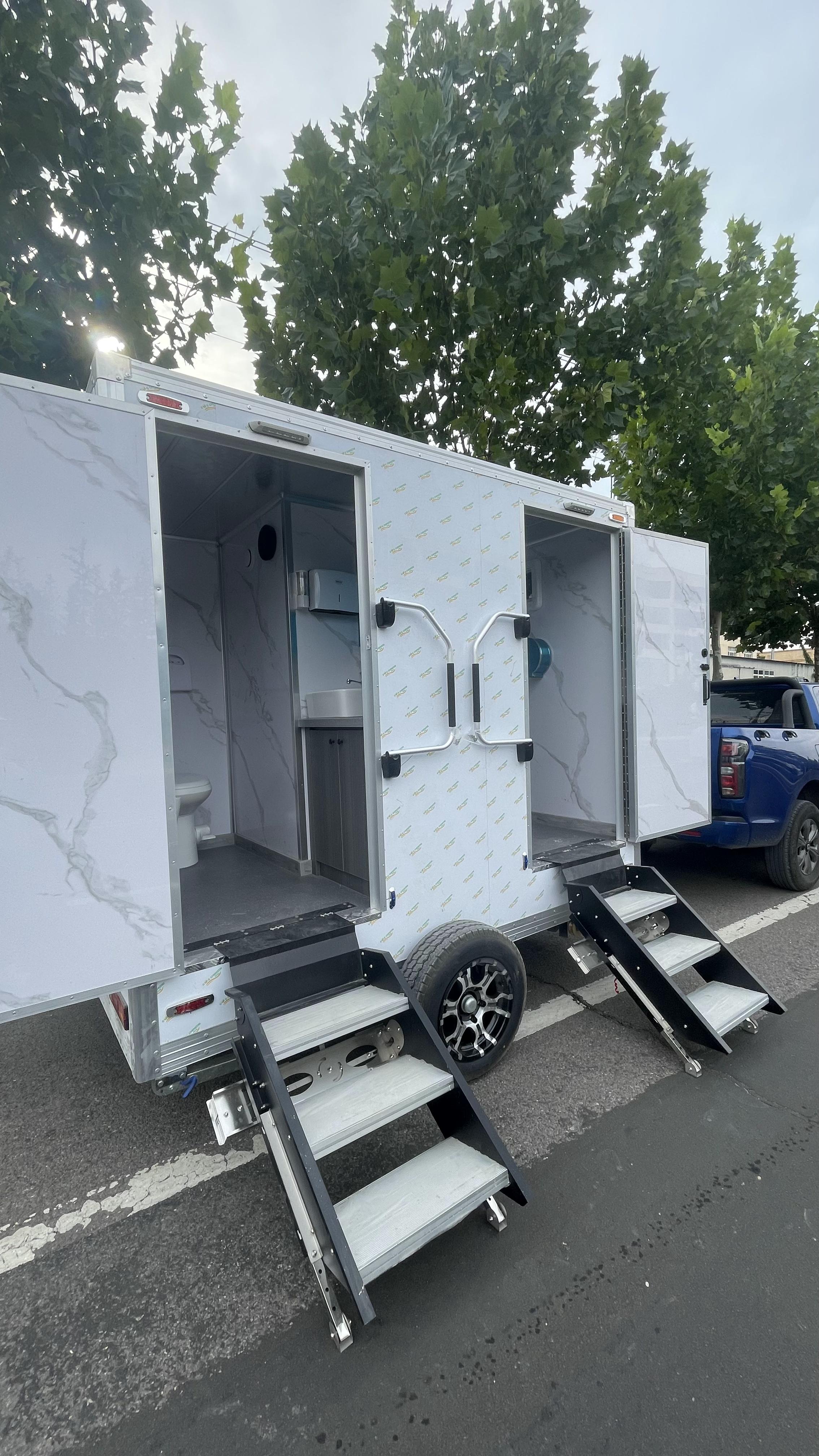 Trailer-mounted mobile double-door toilet for outdoor convenience