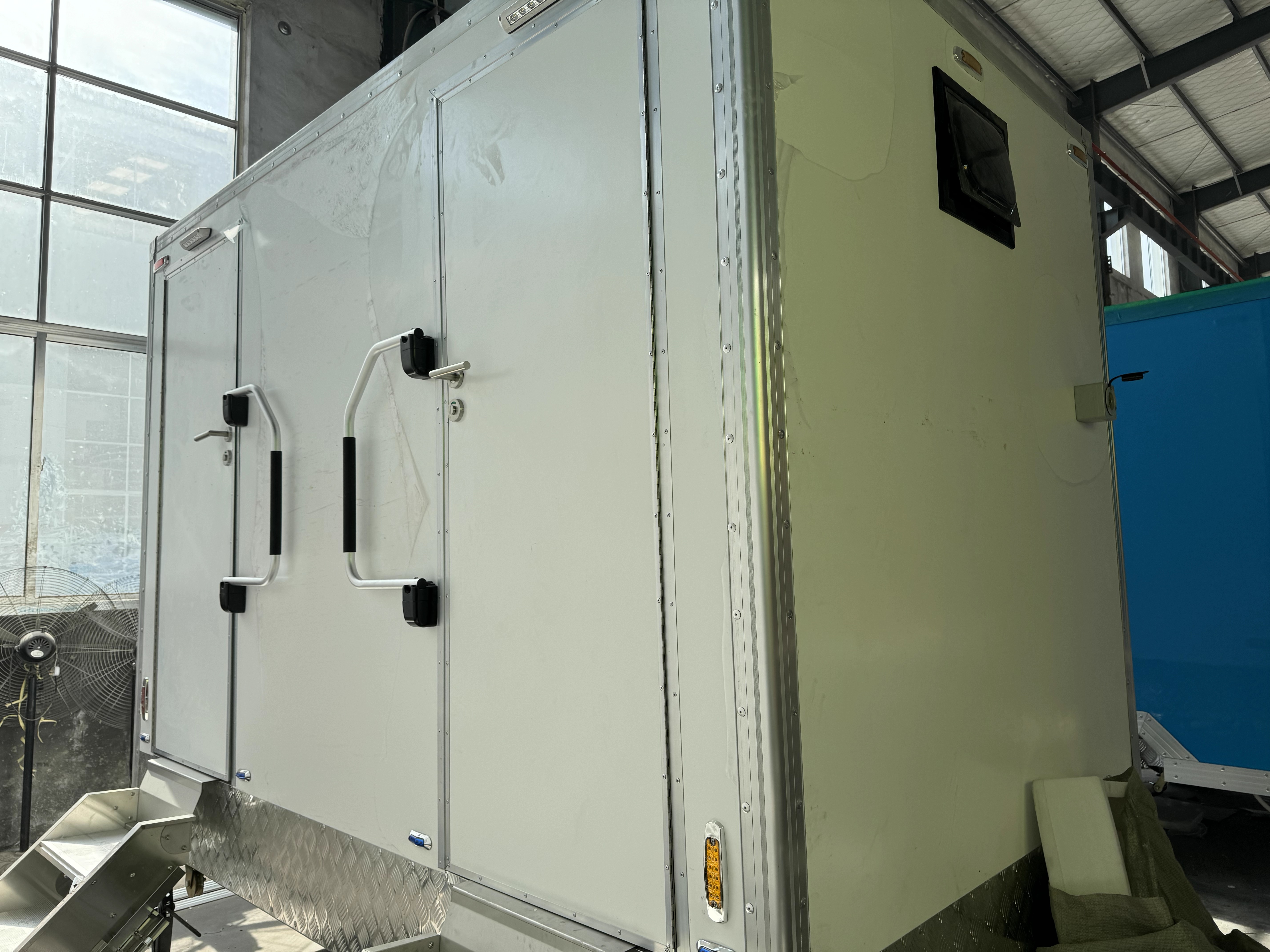 Two-room portable toilet with basic bathroom, suitable for outdoor projects and campsites