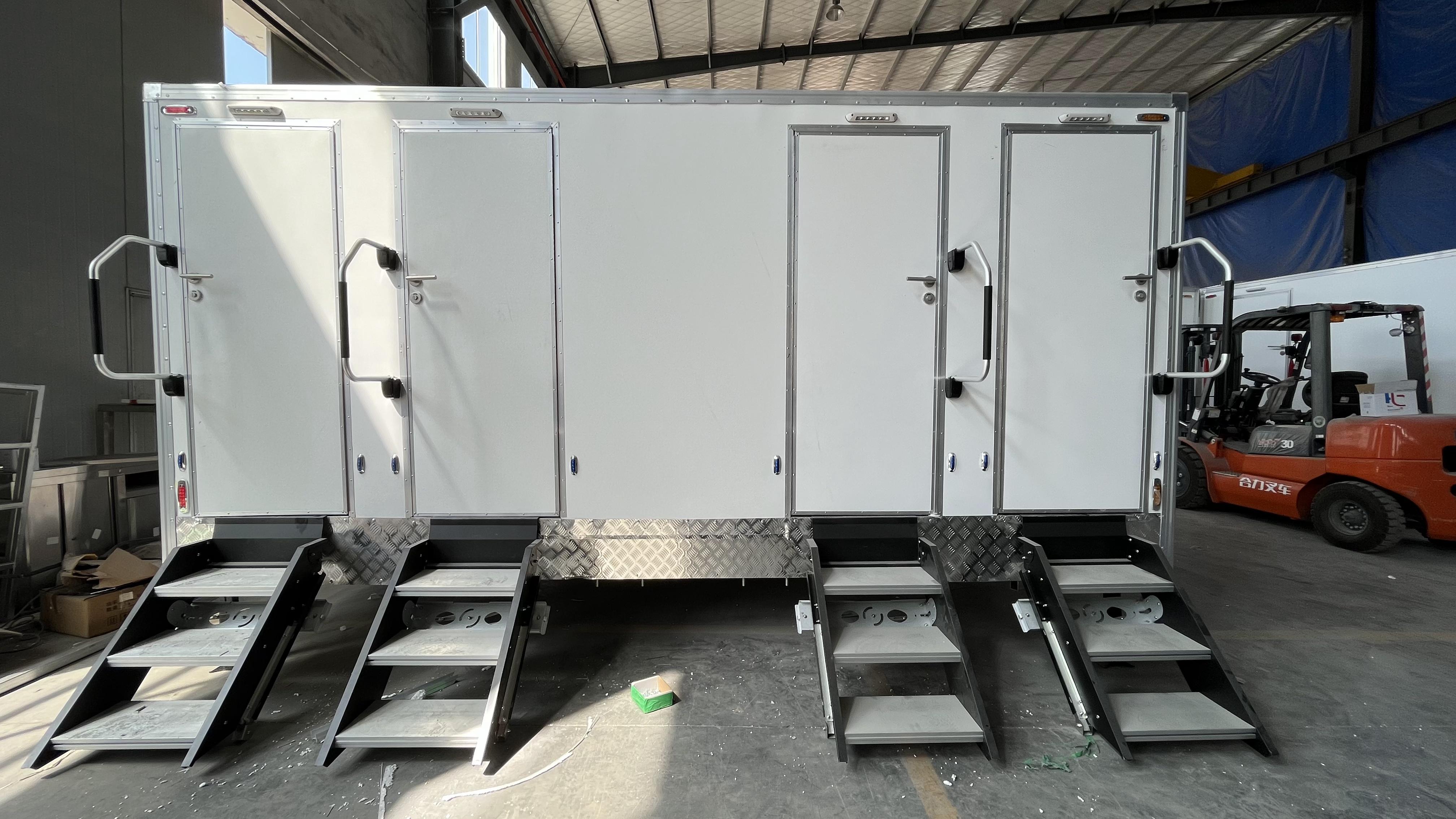 Four-room white mobile toilet