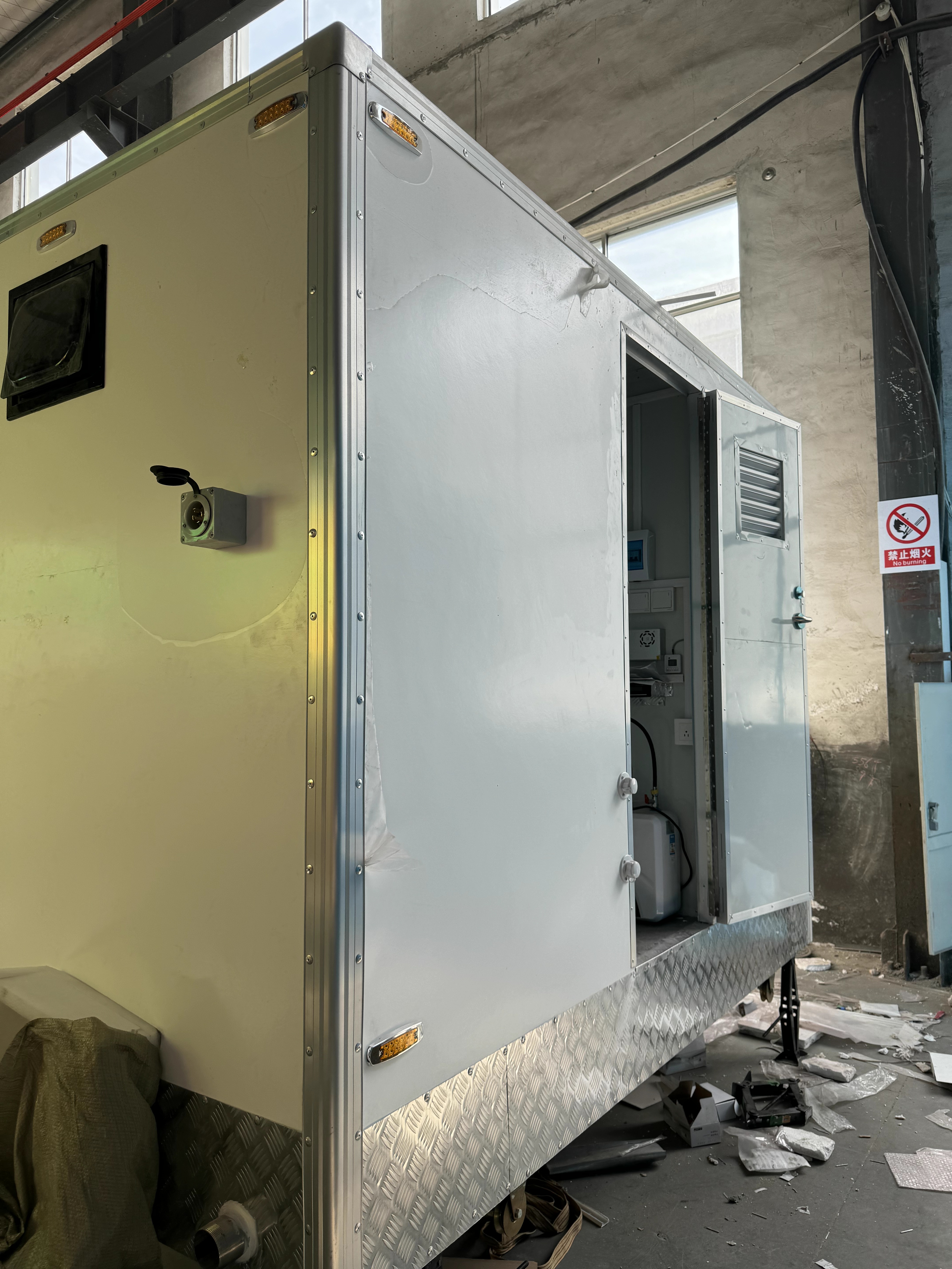 Two-room portable toilet with basic bathroom, suitable for outdoor projects and campsites