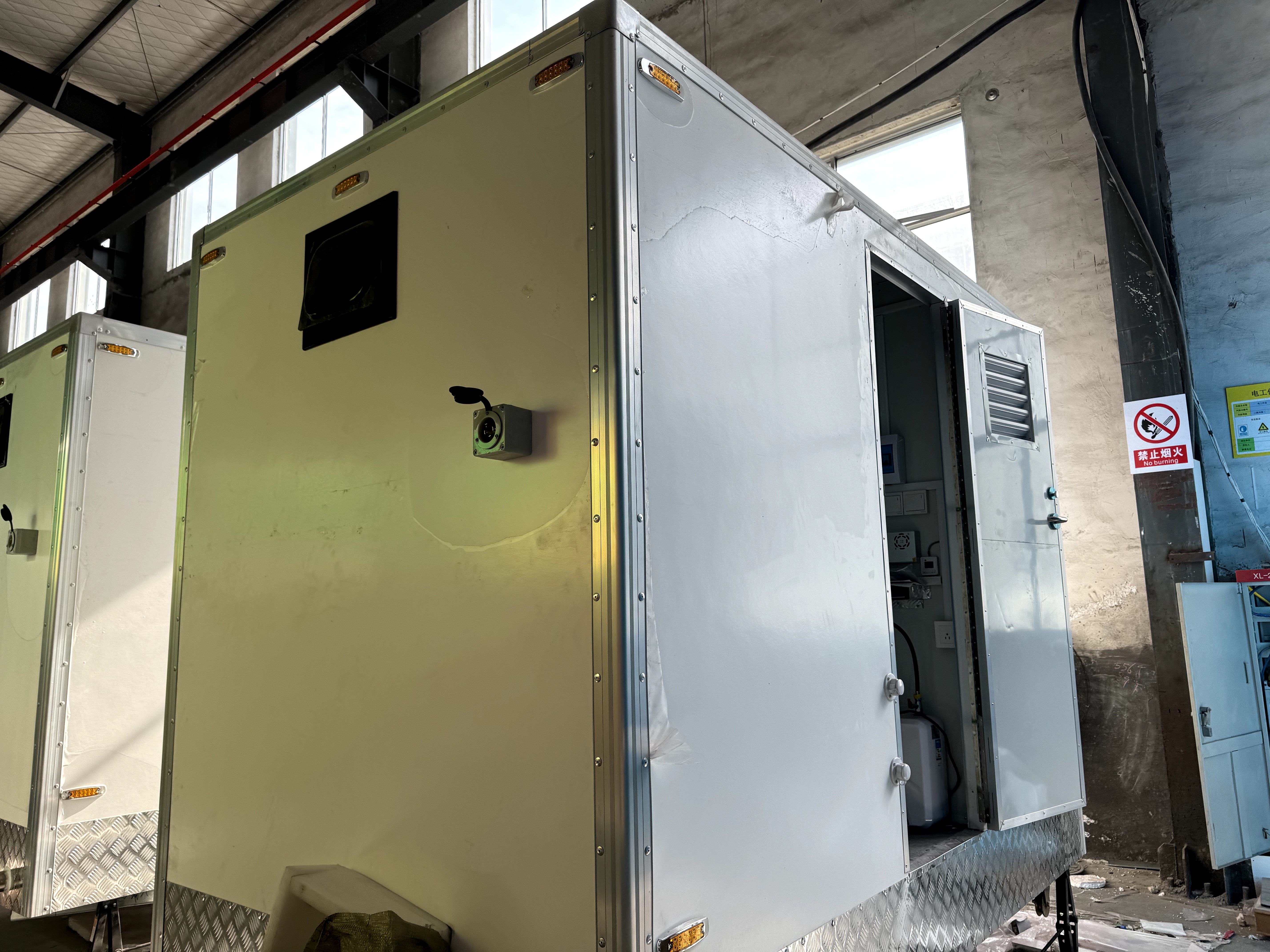 Two-room portable toilet with basic bathroom, suitable for outdoor projects and campsites
