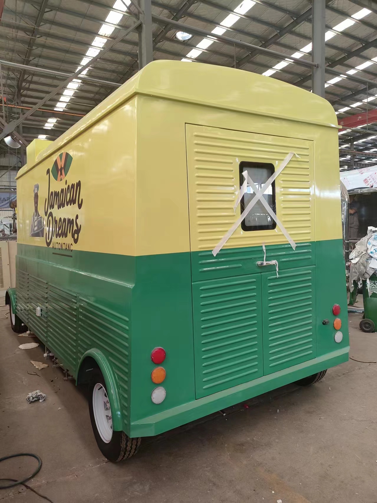Retro-style mobile food truck, yellow and green two-color food vending vehicle
