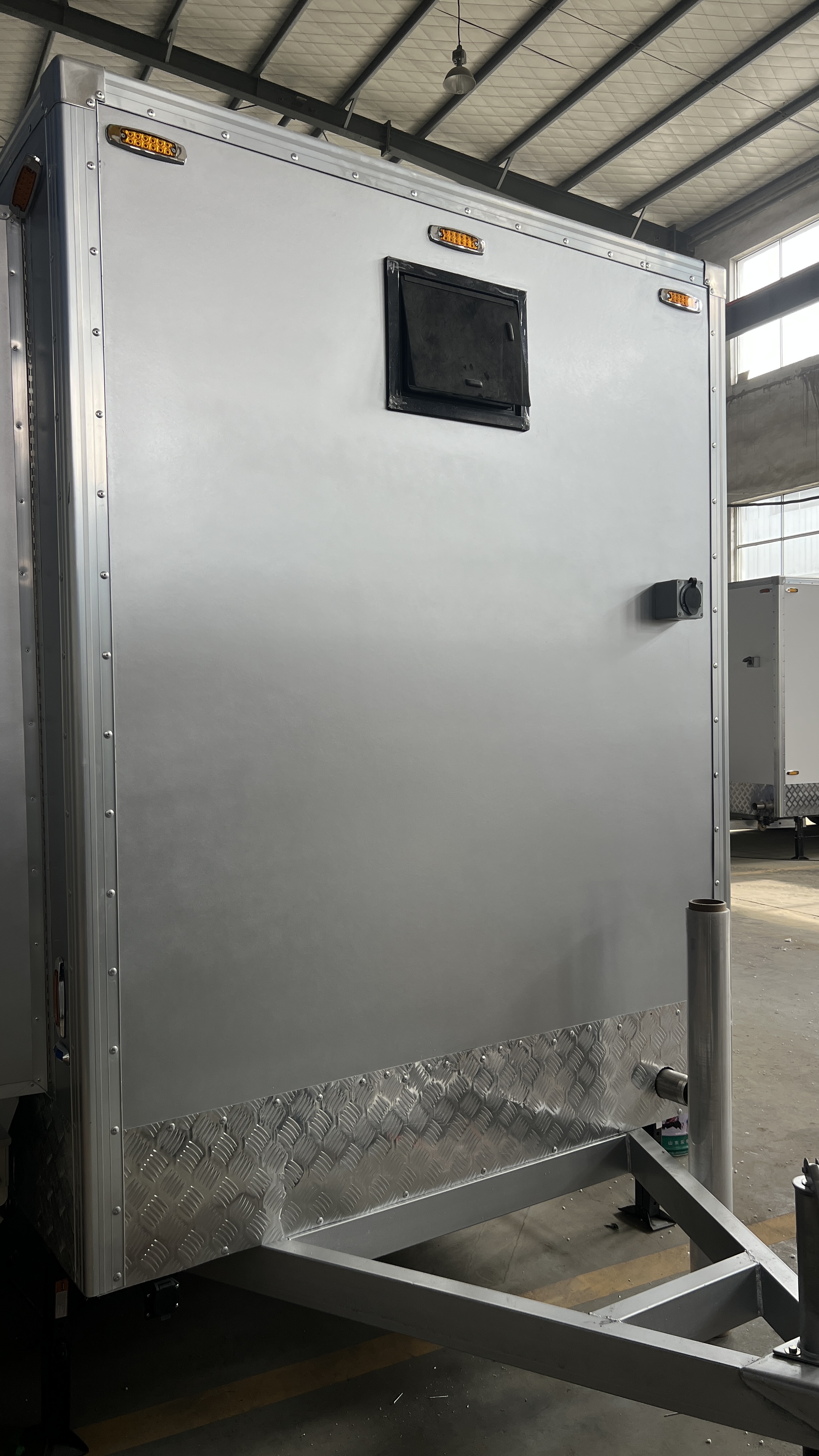 The towable double-door mobile bathroom is made of industrial-grade materials and is practical for flexible deployment