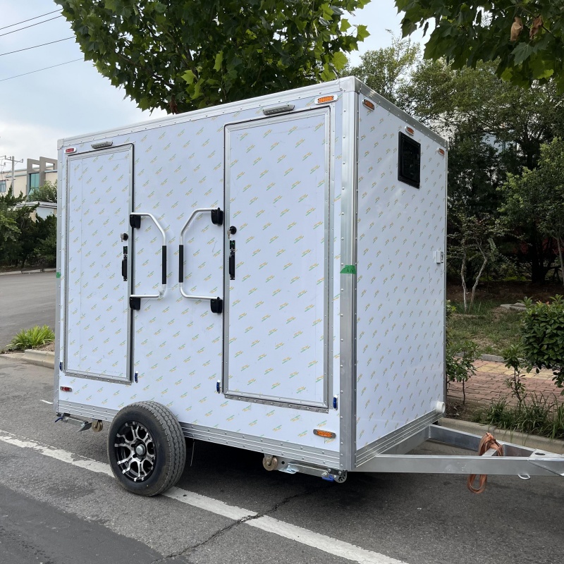 Trailer-mounted mobile double-door toilet for outdoor convenience