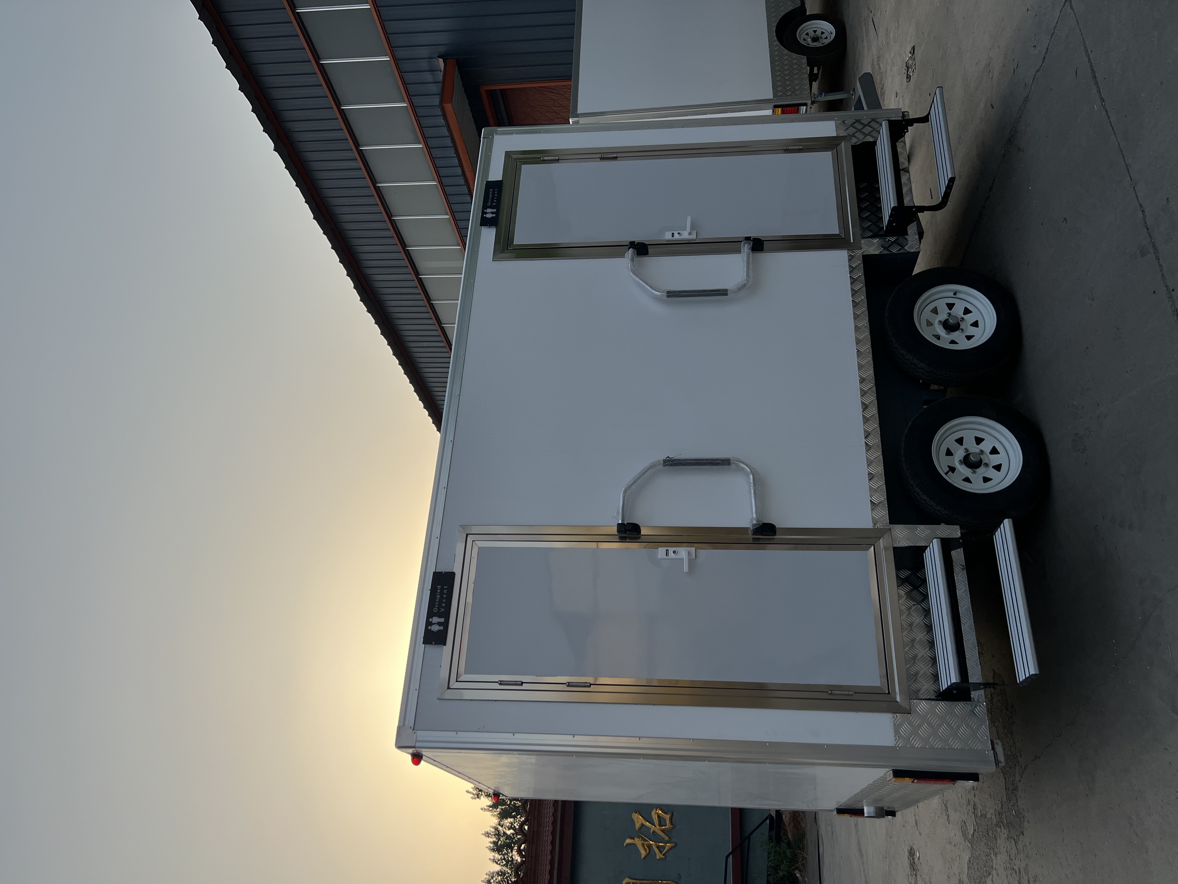 Two-wheel mobile multi-cabin toilet, outdoor emergency and convenient toilet